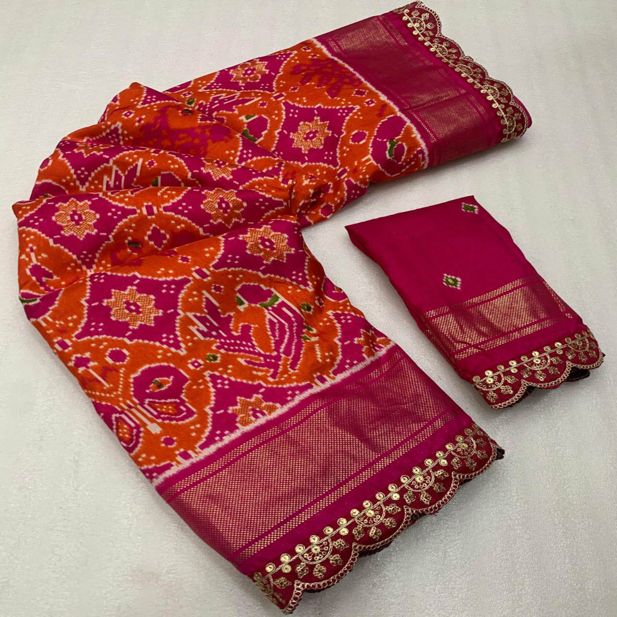 Orange & Pink Ikkat Printed Dola Silk Saree With Sequins Embroidered Border