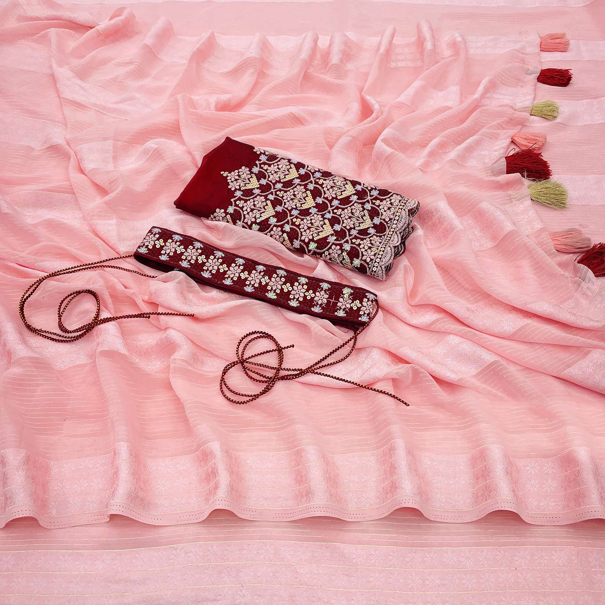 Light Gajari Pink Zari Woven Georgette Saree With Tassels