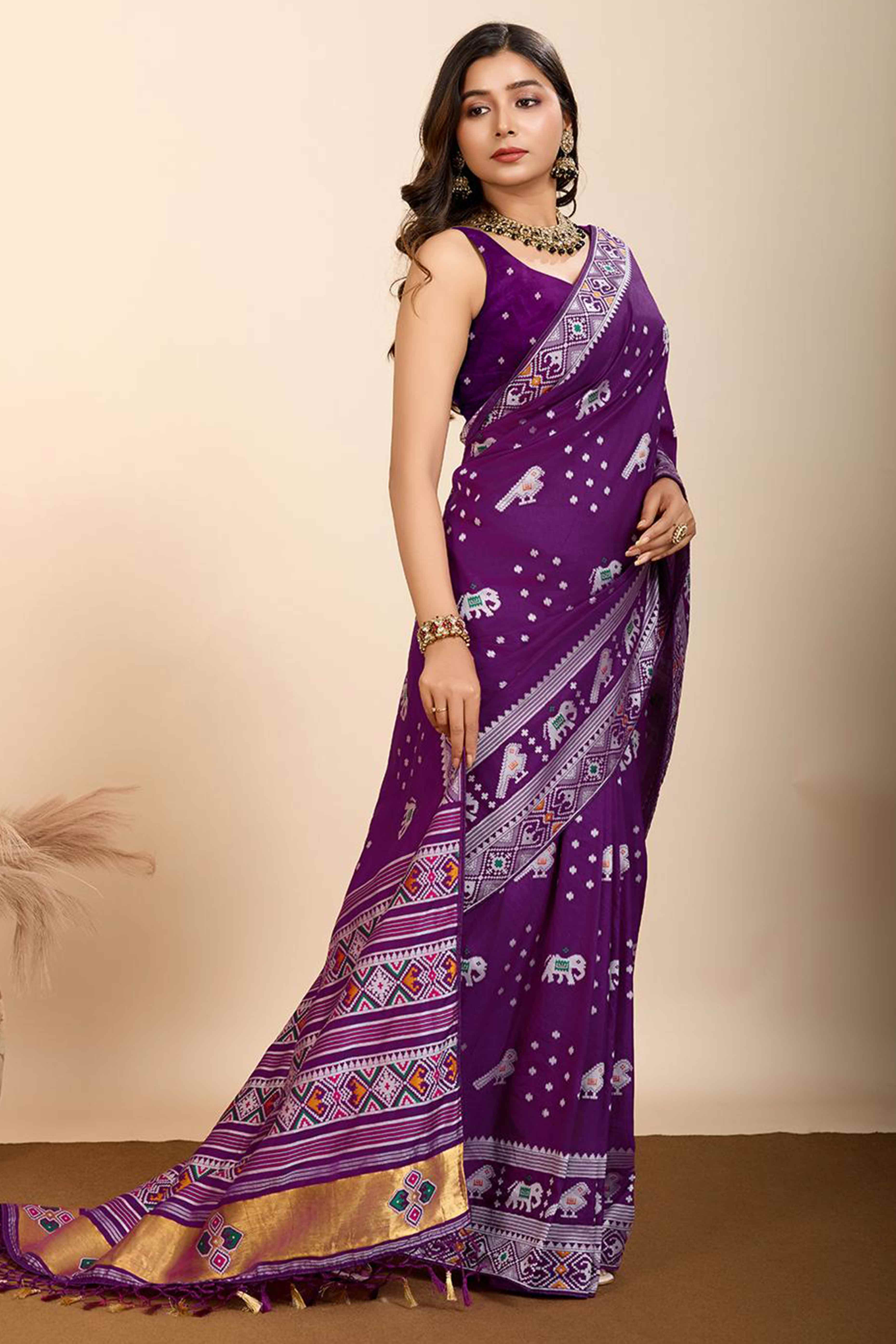 Purple Woven Dola Silk Patola Saree With Tassels