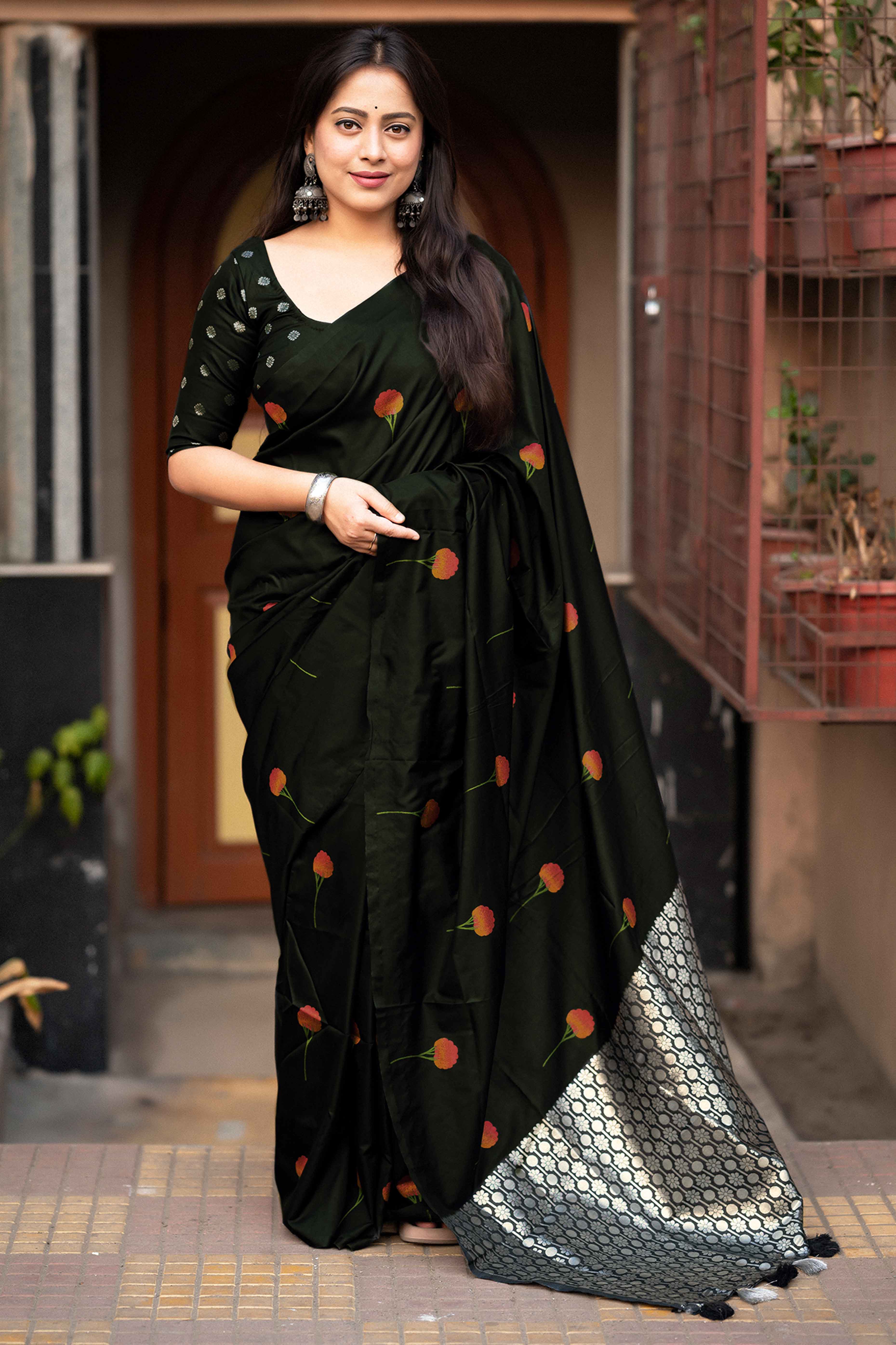 Graceful Black Banarasi Silk Saree With Floral Zari Weaving & Tassel Border