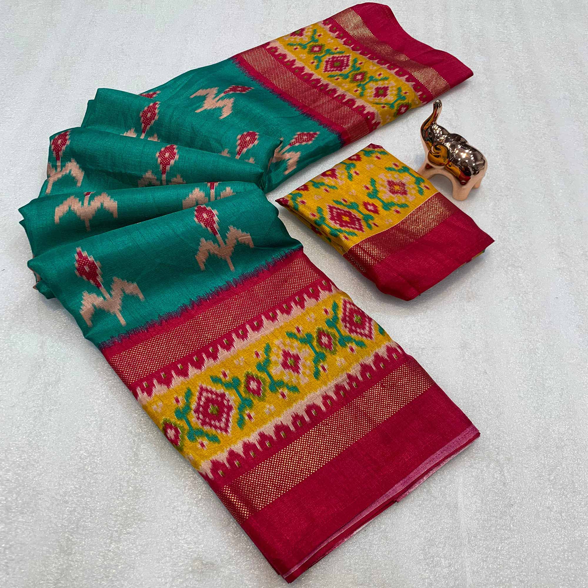 Subtle and Stylish Teal Saree with Ikkat Prints in Luxe Dola Silk for Festive Wear