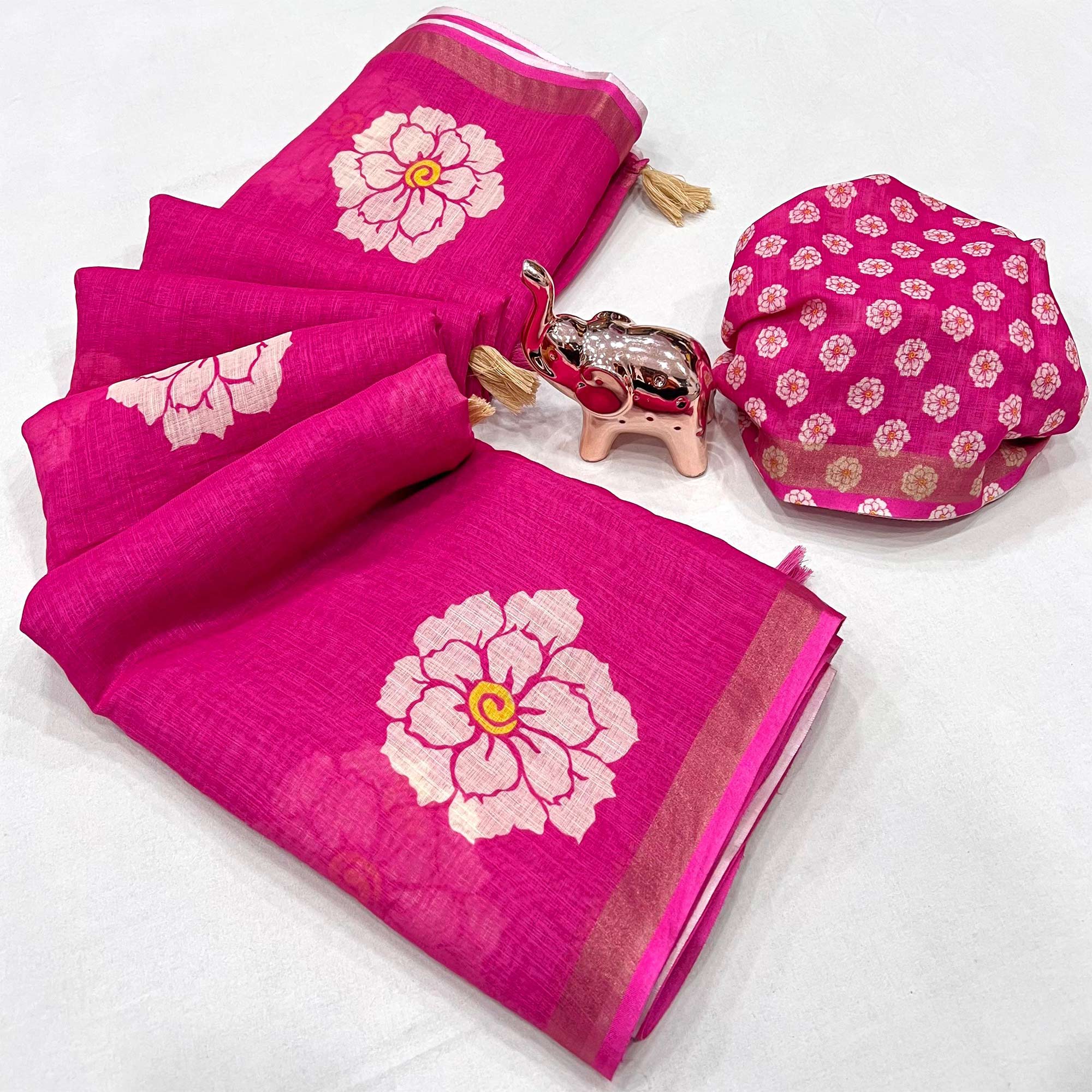 Graceful Rani Pink Floral Printed Saree in Linen Silk with Delicate Tassel Accents