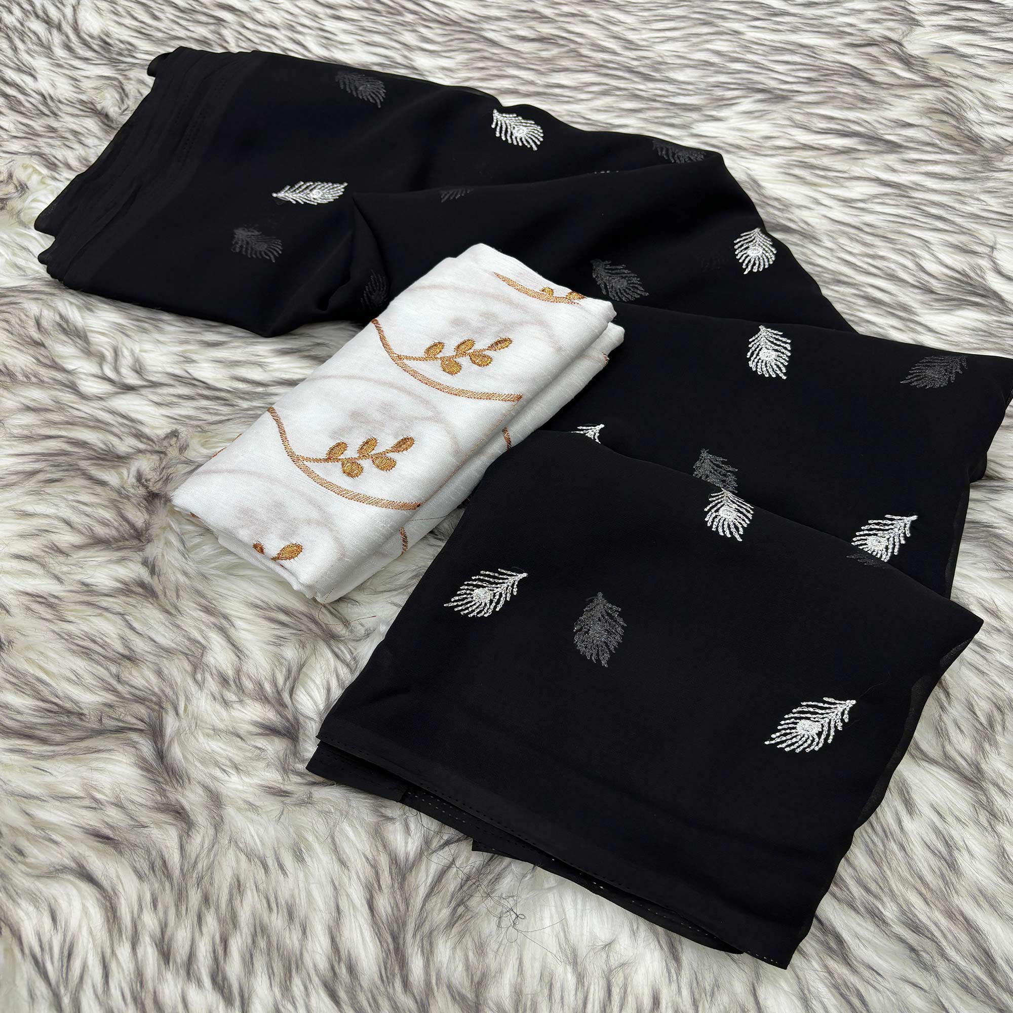 Black Embroidered Georgette Saree With Tassels