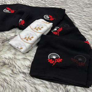 Black Floral Embroidered Georgette Saree With Tassels