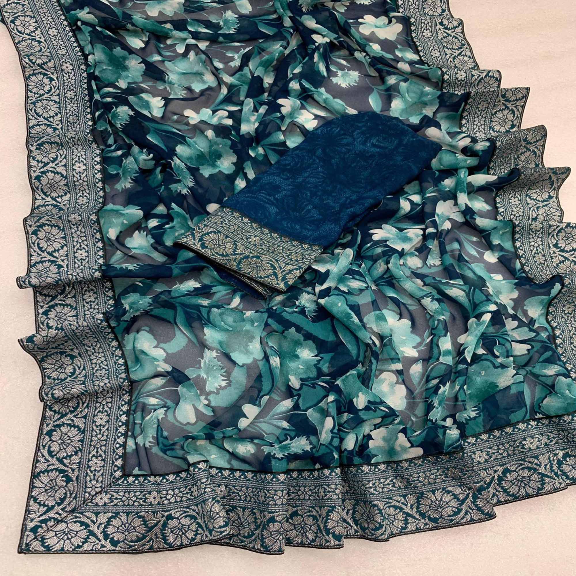 Teal Floral Printed Georgette Saree With Woven Border