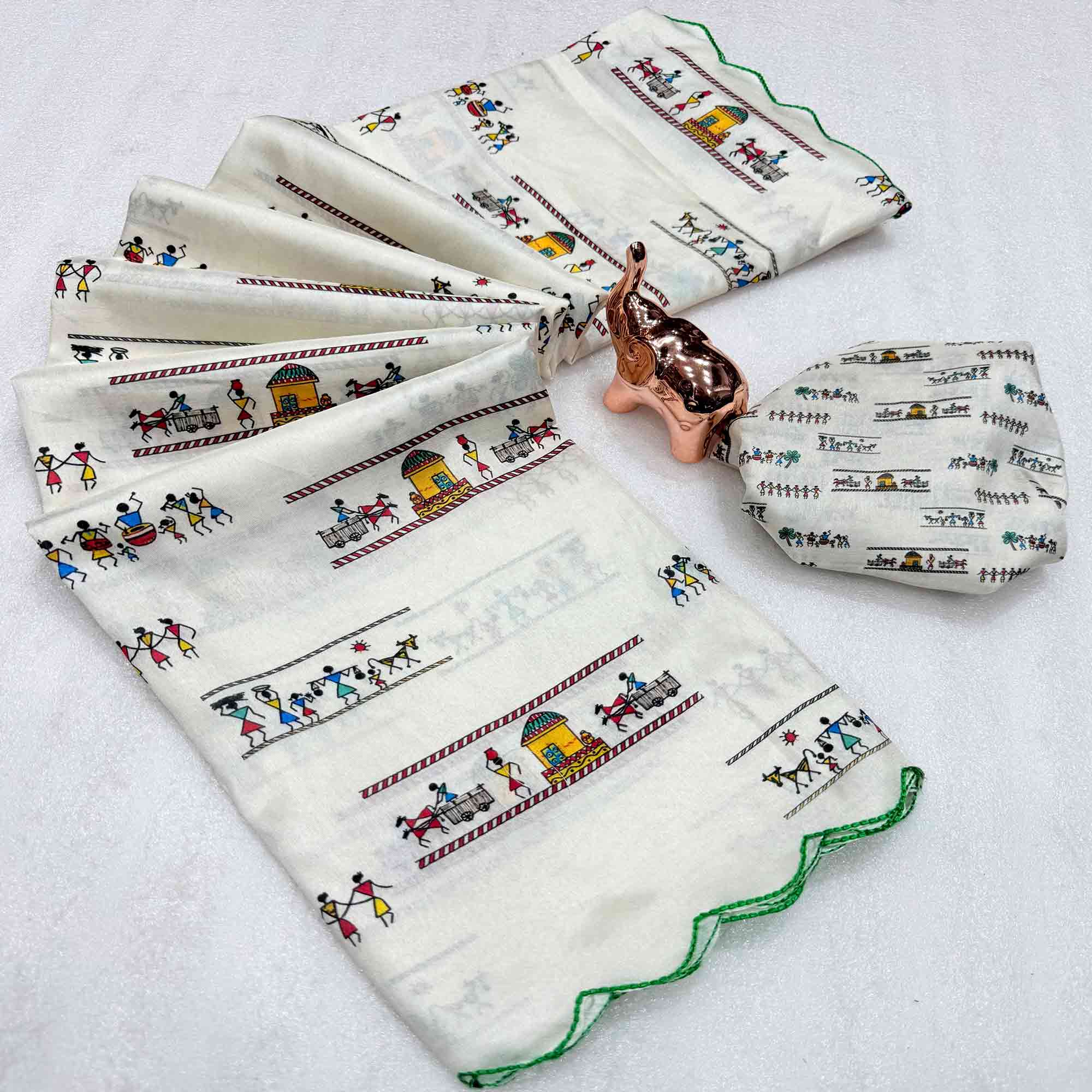 Graceful Off White Dola Silk Saree Highlighted with Handcrafted Warli Motifs