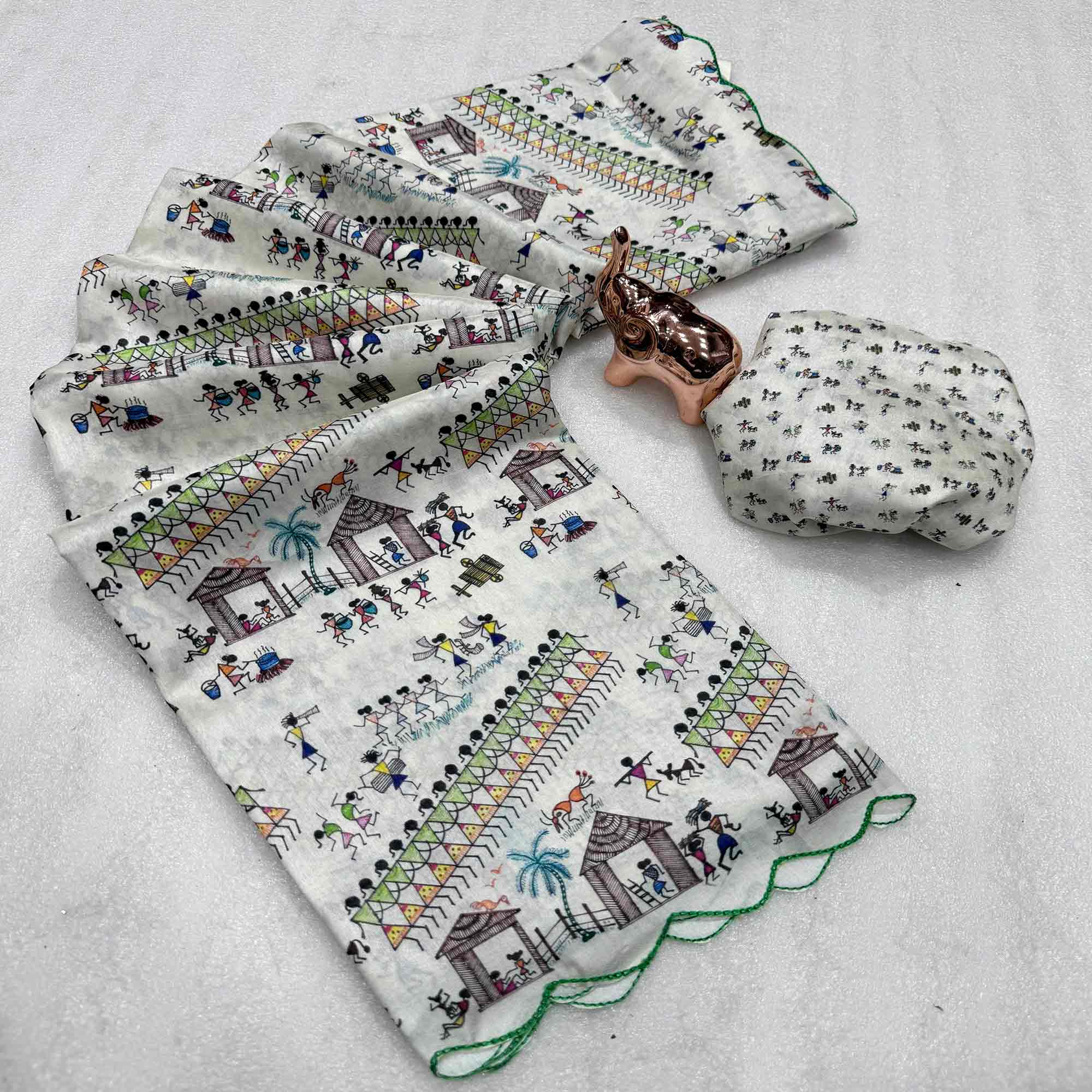 Sophisticated Off White Dola Silk Saree Adorned with Traditional Warli Patterns