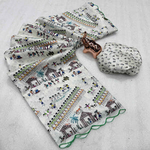 Sophisticated Off White Dola Silk Saree Adorned with Traditional Warli Patterns