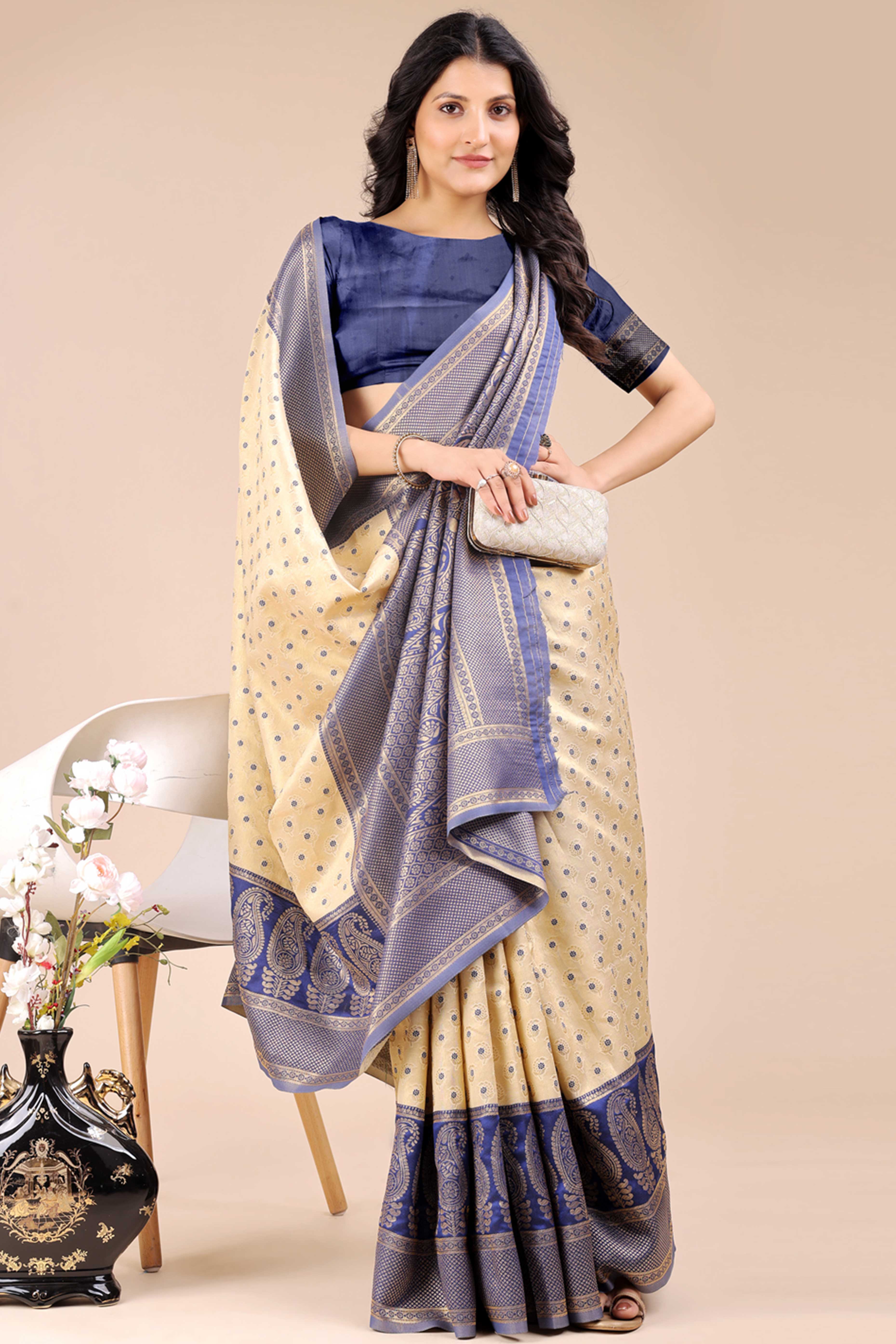 Cream Banarasi Silk Saree Featuring Lustrous Navy Blue Floral Zari Weaving and a Rich Contrast Border