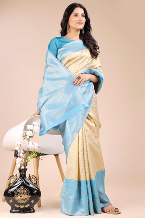 Cream Banarasi Silk Saree Featuring Lustrous Sky Blue Floral Zari Weaving and a Rich Contrast Border