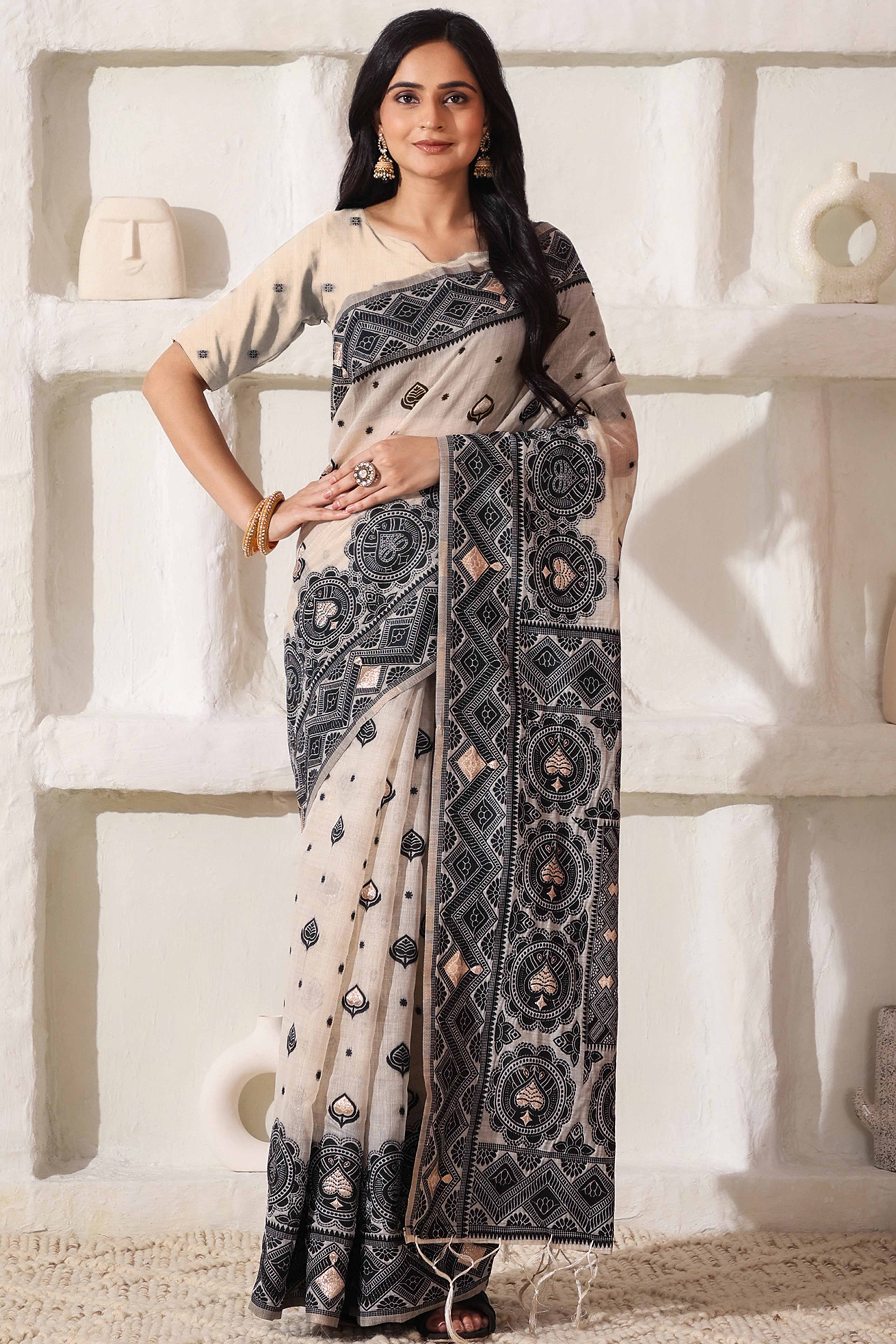 Timeless Cream & Black Saree In Linen Cotton With Rich Zari Weaving And Tassel Pallu