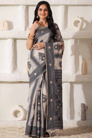 Elegant Zari Weaving Work On Cream & Black Linen Cotton Saree With Tassel Finish