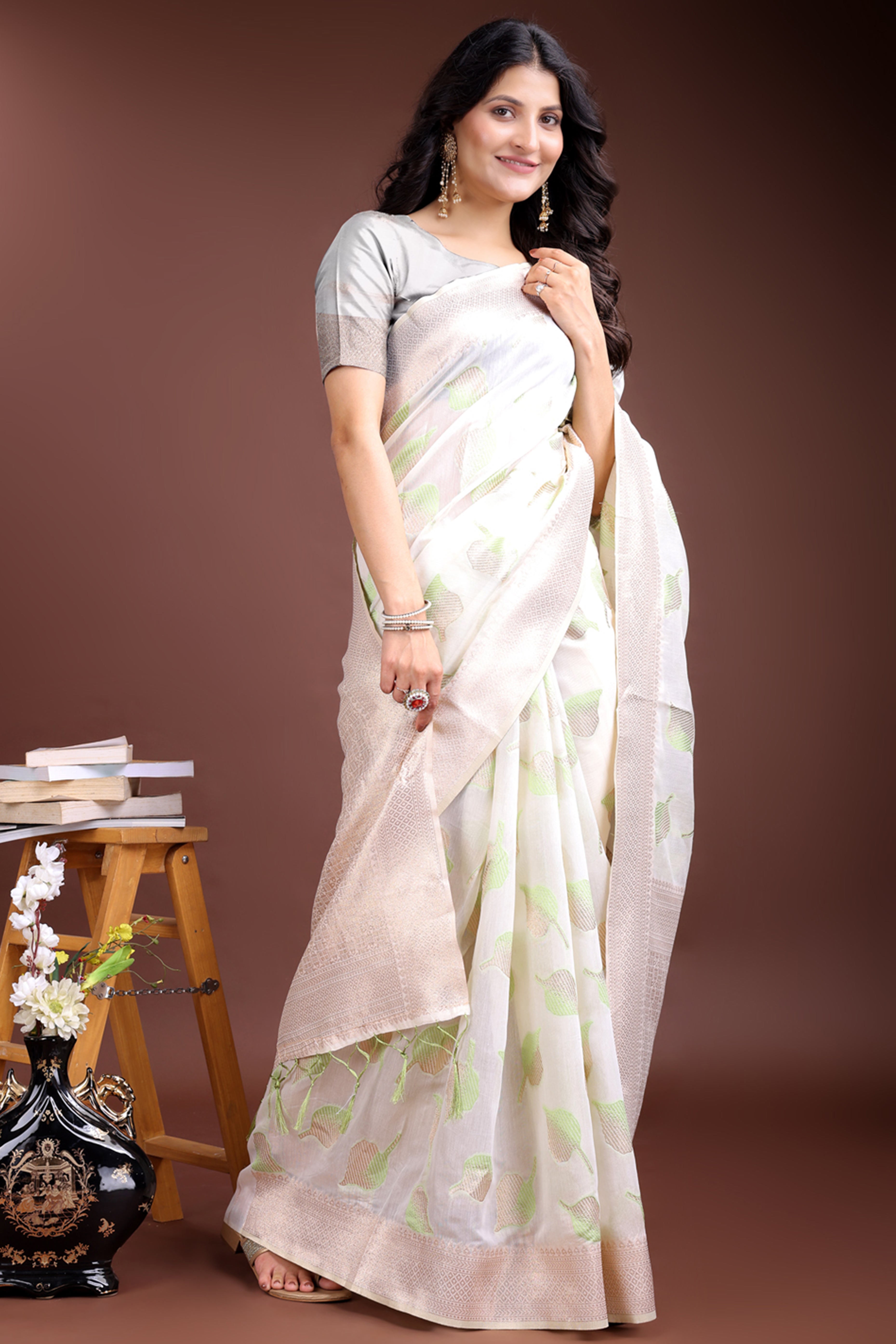 White and Light Green Cotton Silk Saree with Leaf Motifs and Zari Border Tassels