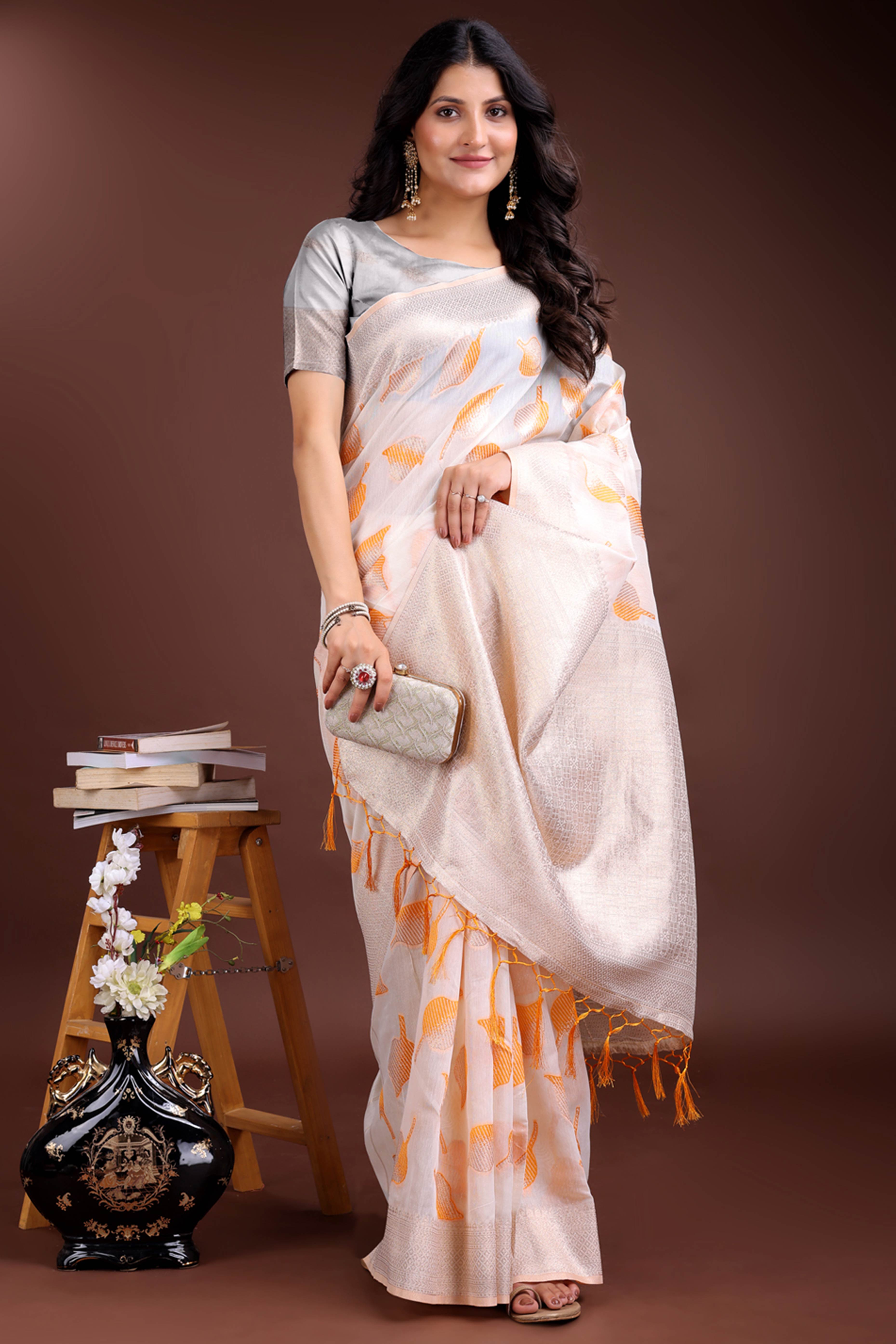 White and Orange Cotton Silk Saree with Leaf Motifs and Zari Border Tassel Style