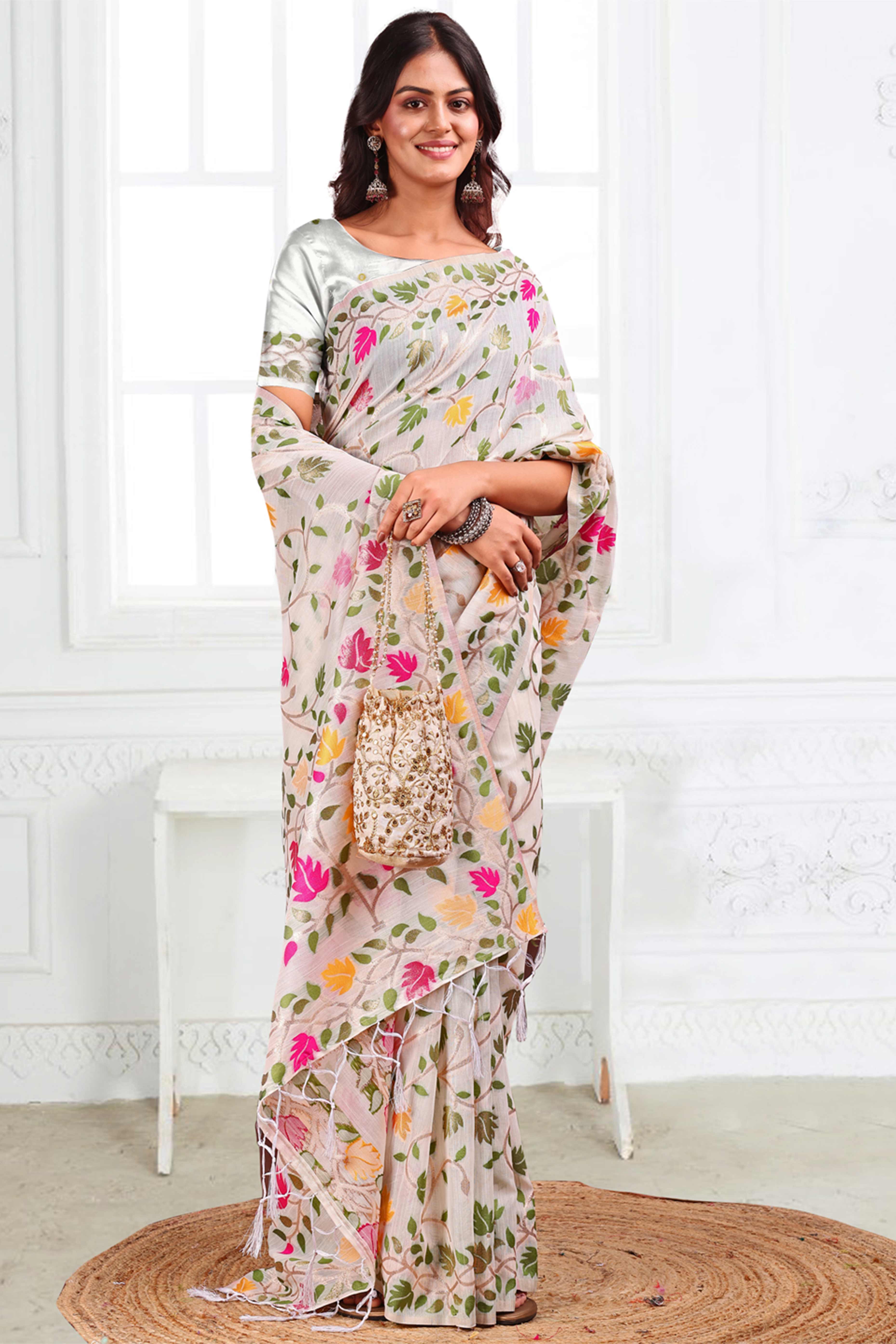 White Linen Cotton Silk  Saree Enhanced With Floral Zari Weaving & Tasselled Pallu Finish