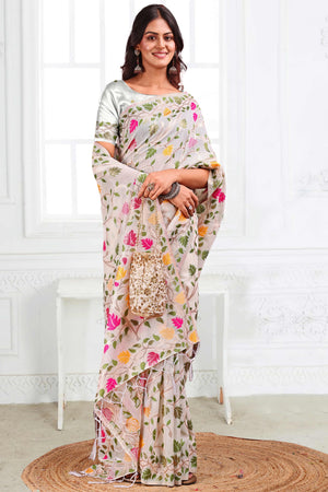 White Linen Cotton Silk  Saree Enhanced With Floral Zari Weaving & Tasselled Pallu Finish