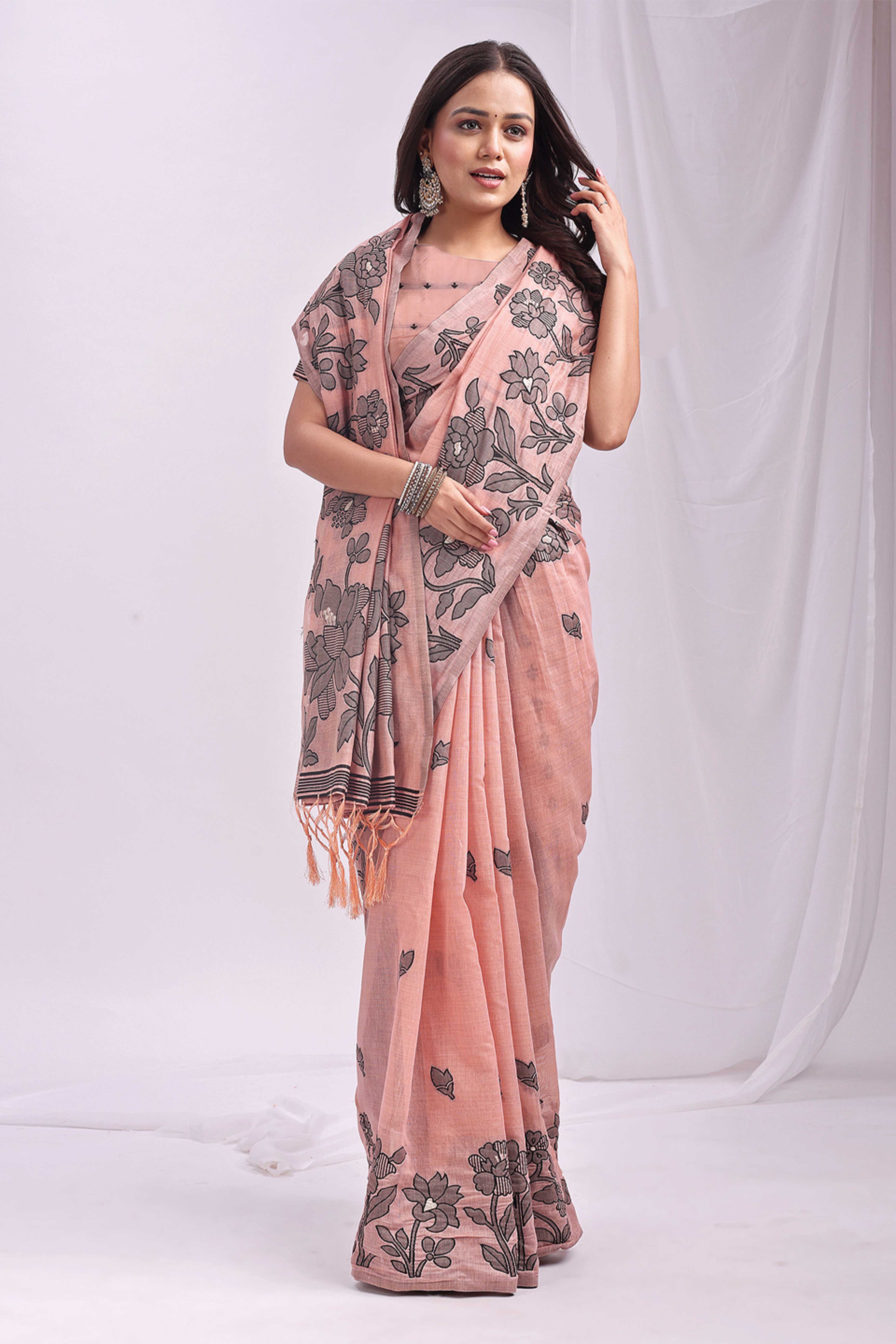 Peach Ethnic Saree in a Linen Cotton Blend Adorned with Floral Weave Designs