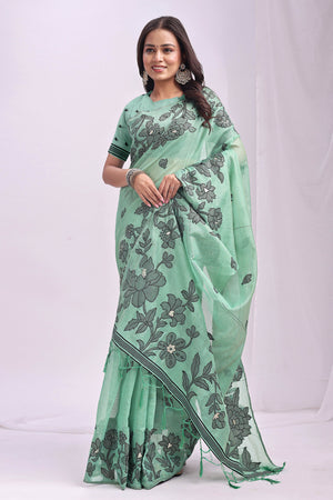 Rama Green Ethnic Saree in a Linen Cotton Blend Adorned with Floral Weave Designs