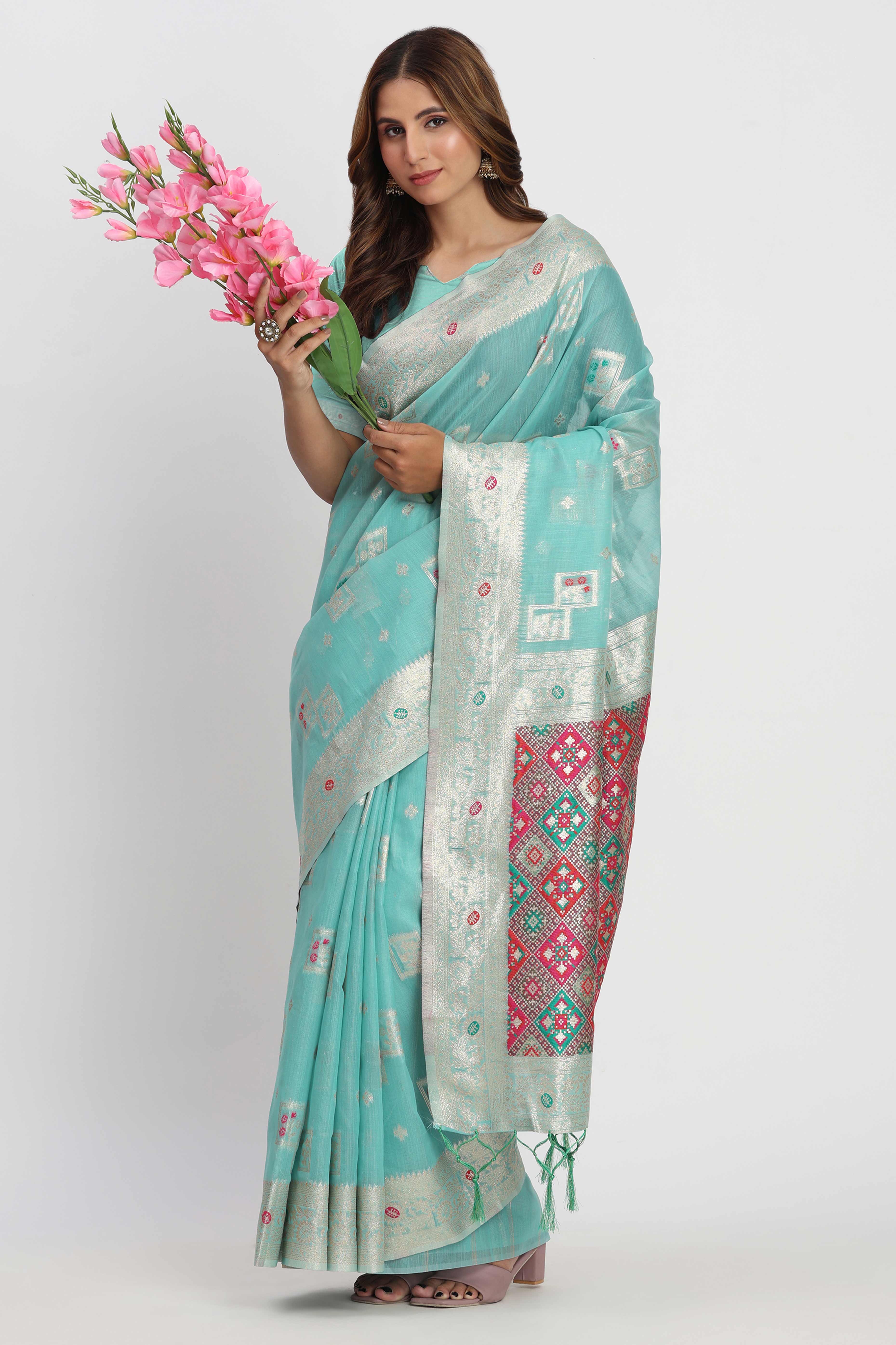 Floral Zari Weaving Brings Regal Beauty To This Turquoise Linen Cotton Saree With Tassel Accents