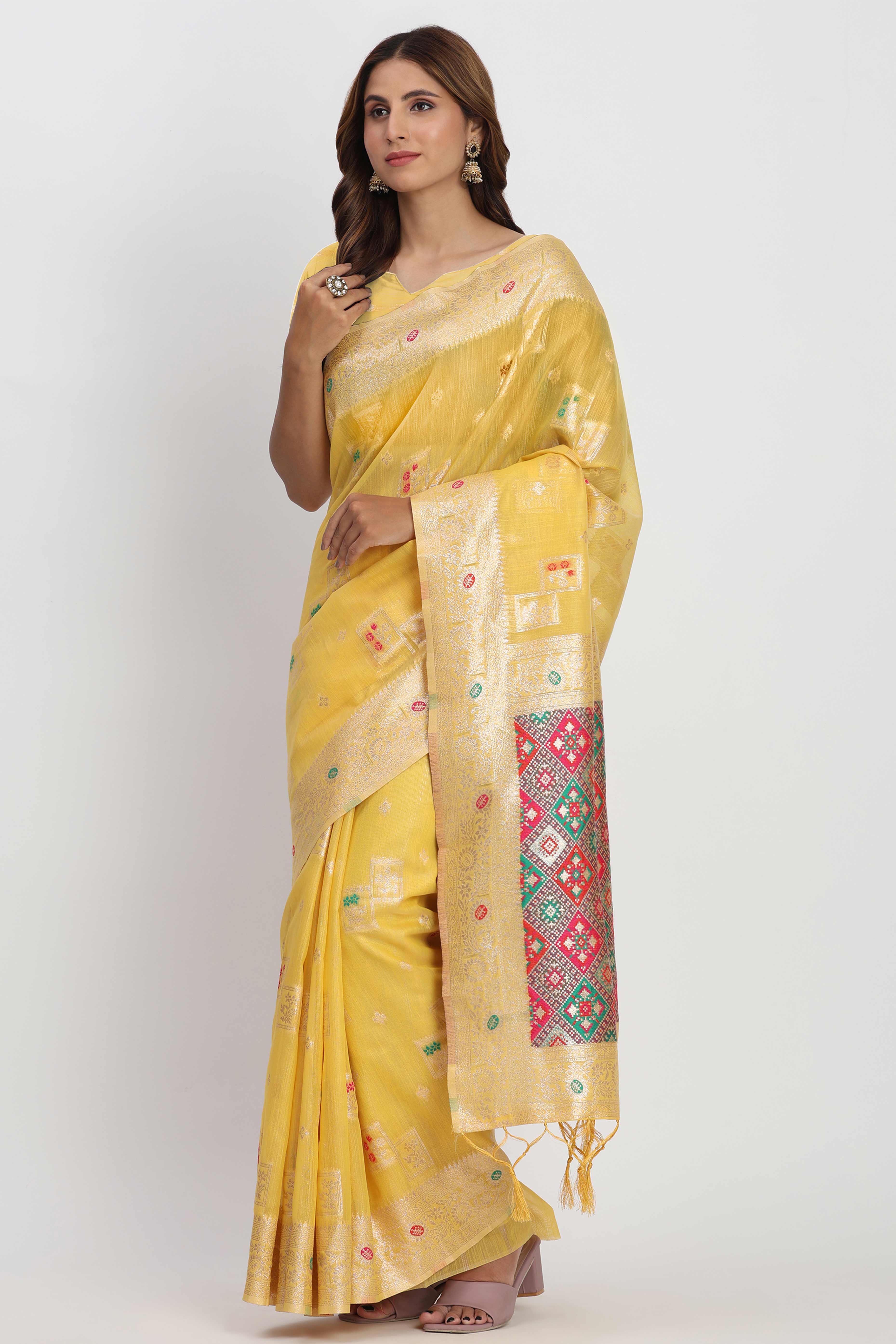 Floral Zari Weaving Brings Regal Beauty To This Yellow Linen Cotton Saree With Tassel Accents