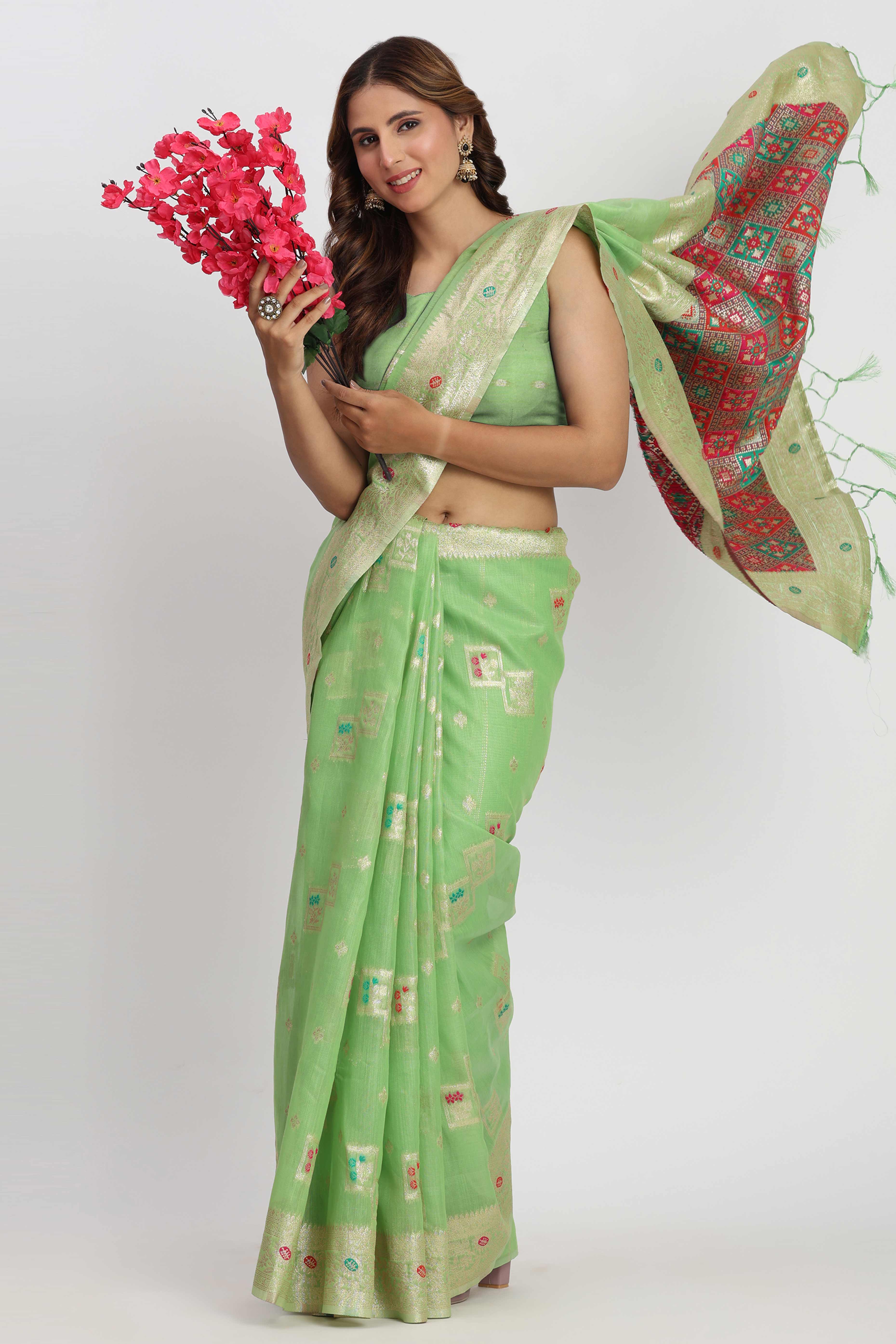 Floral Zari Weaving Brings Regal Beauty To This Light Green Linen Cotton Saree With Tassel Accents