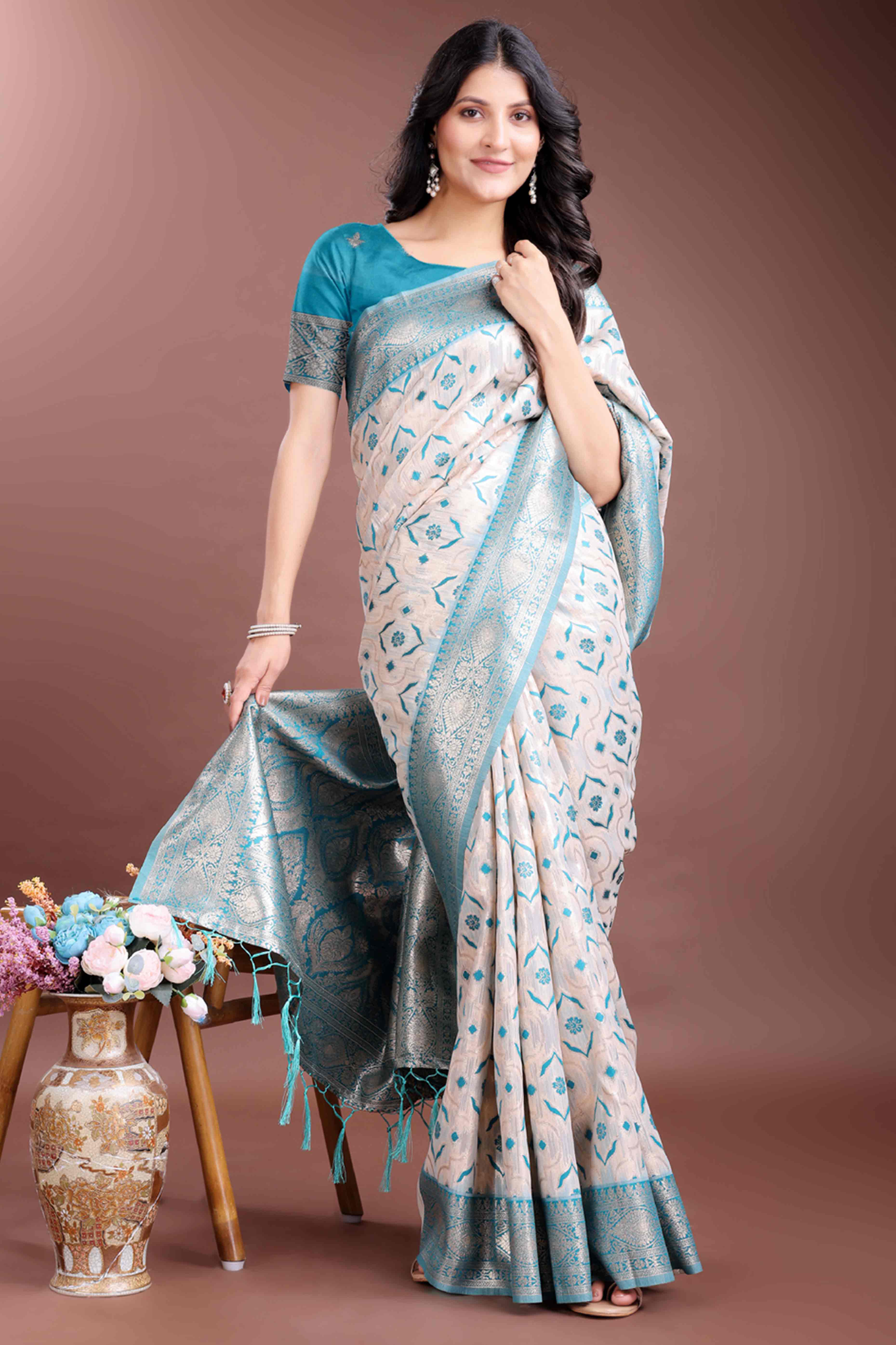 Brilliant Turquoise Traditional Ikkat Style Zari Weaving Cotton Blend Saree with Stunning Tassel Accents