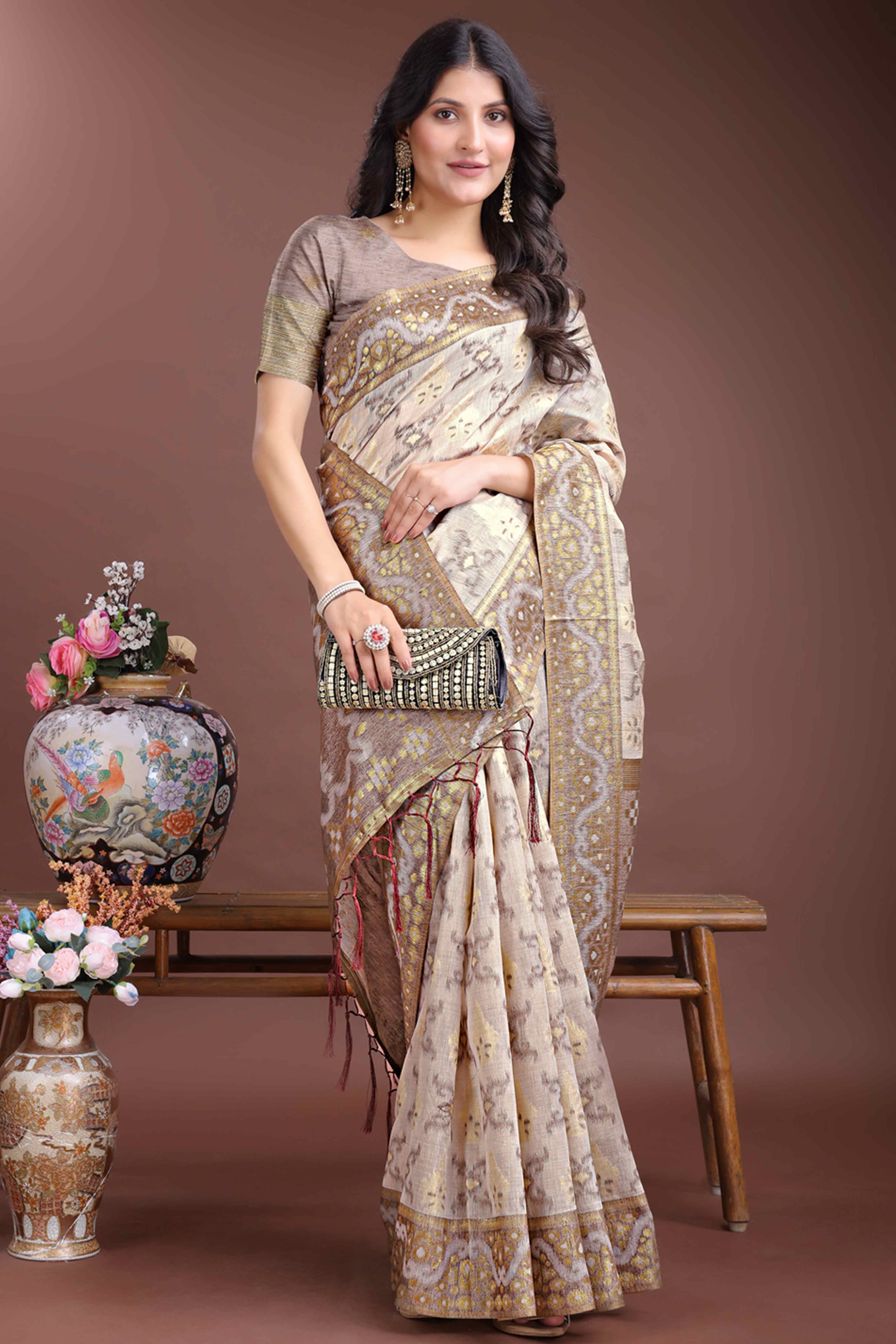 Sophisticated Brown Traditional Ikkat Style Zari Weaving Cotton Blend Saree Adorned with Elegant Tassels