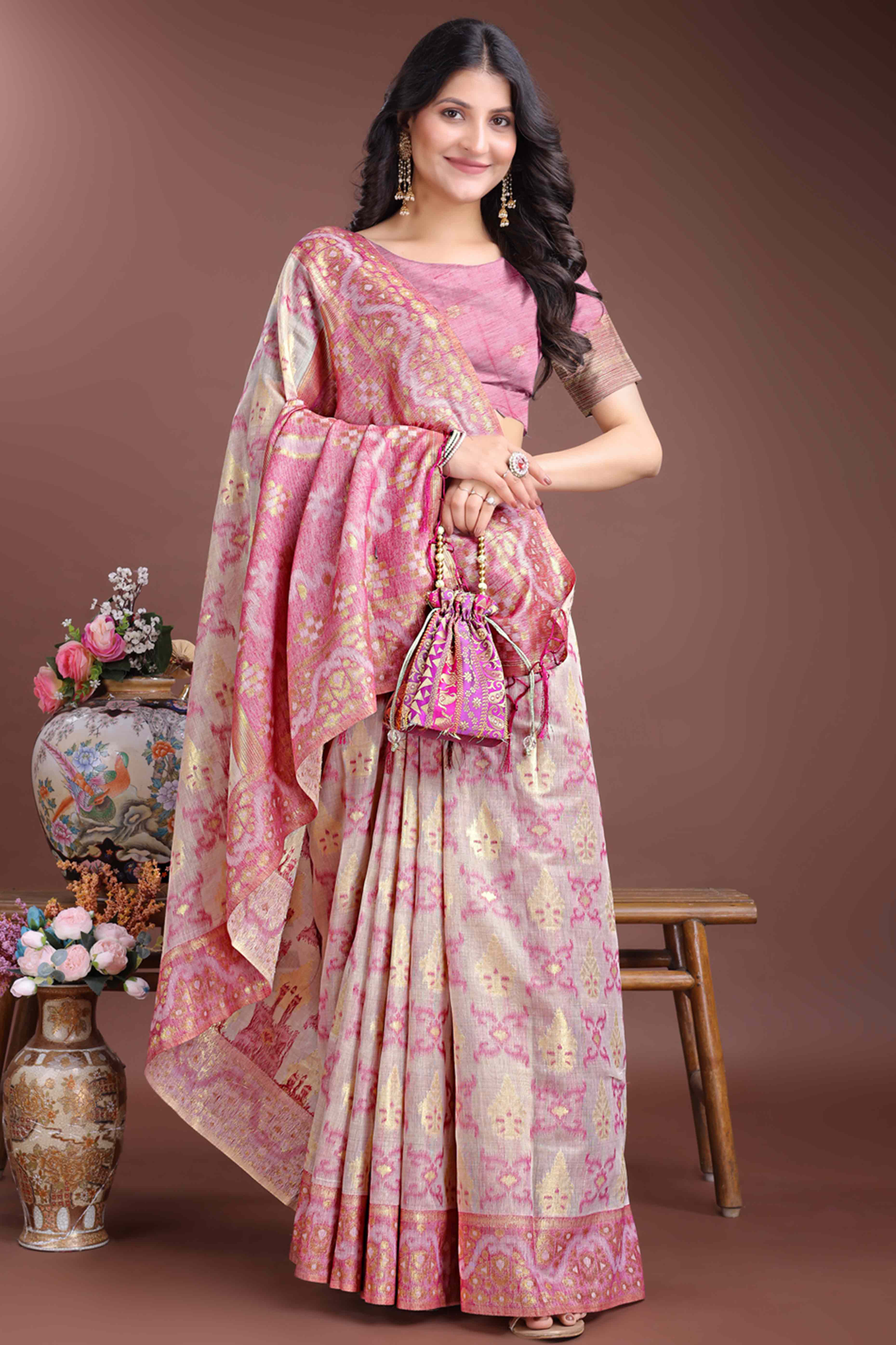 Graceful Pink Traditional Ikkat Style Zari Weaving Cotton Blend Saree with Lovely Tassel Accents