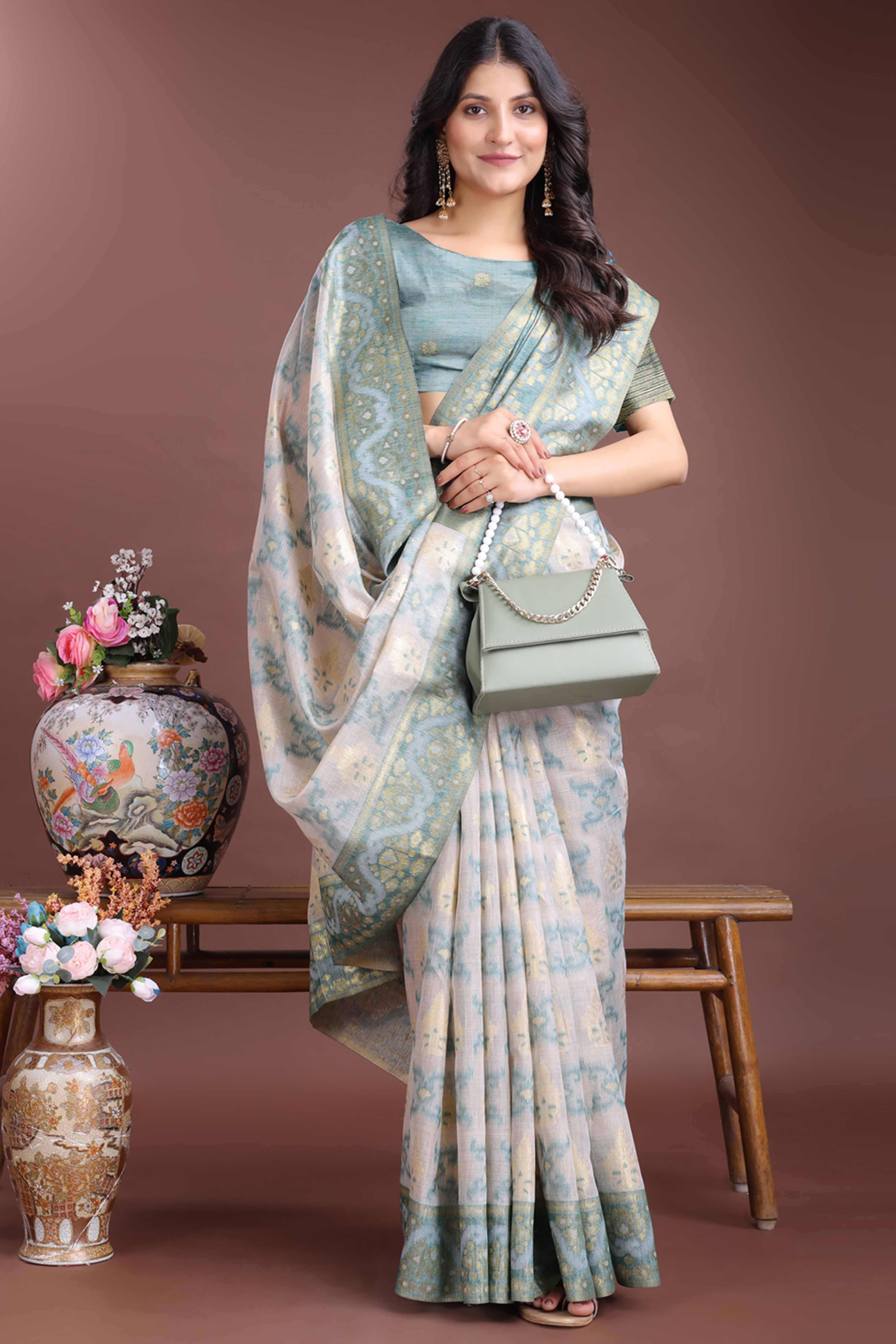 Serene Sea Green Traditional Ikkat Style Zari Weaving Cotton Blend Saree with Artistic Tassel Details