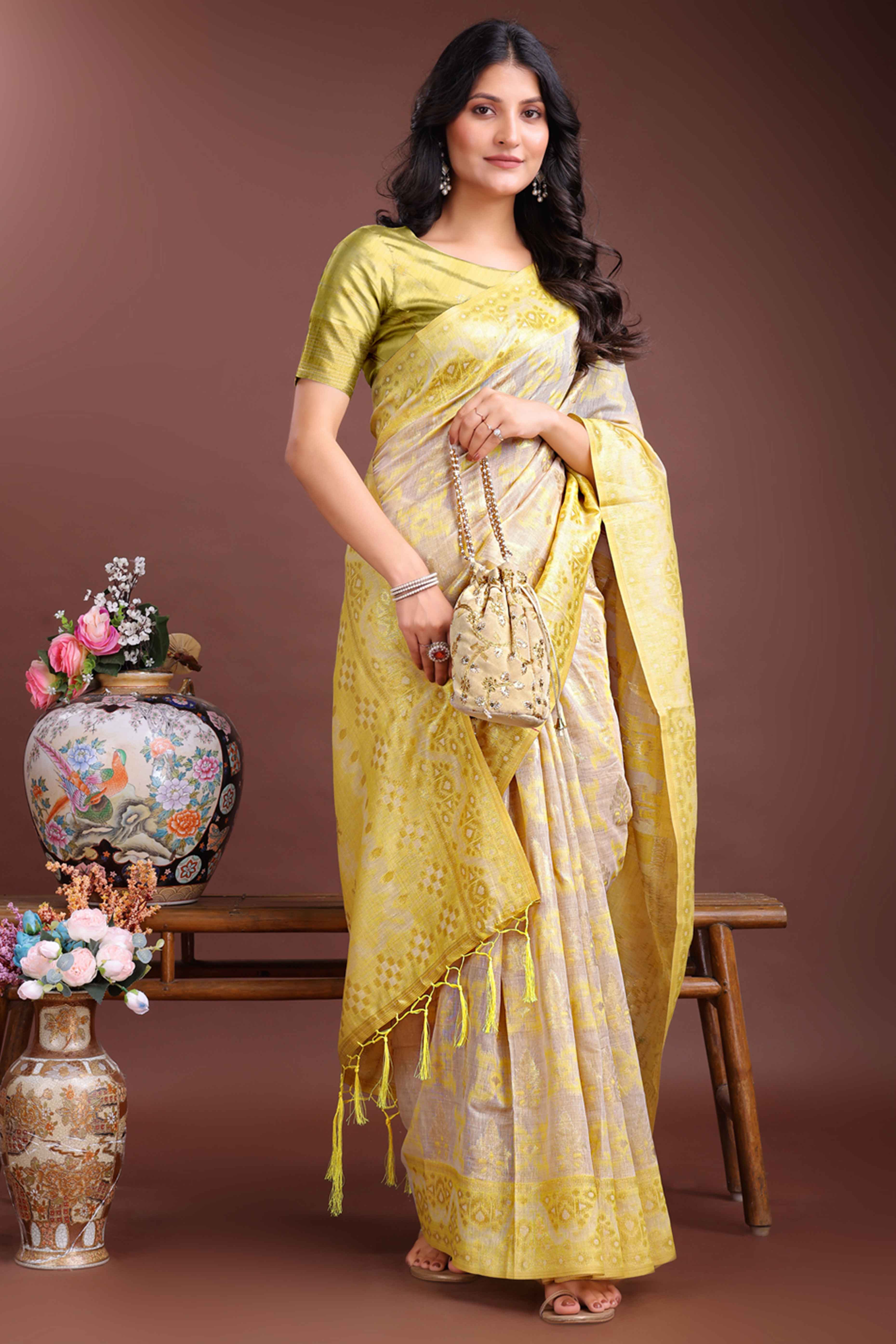 Radiant Yellow Traditional Ikkat Style Zari Weaving Cotton Blend Saree with Vibrant Tassel Embellishments