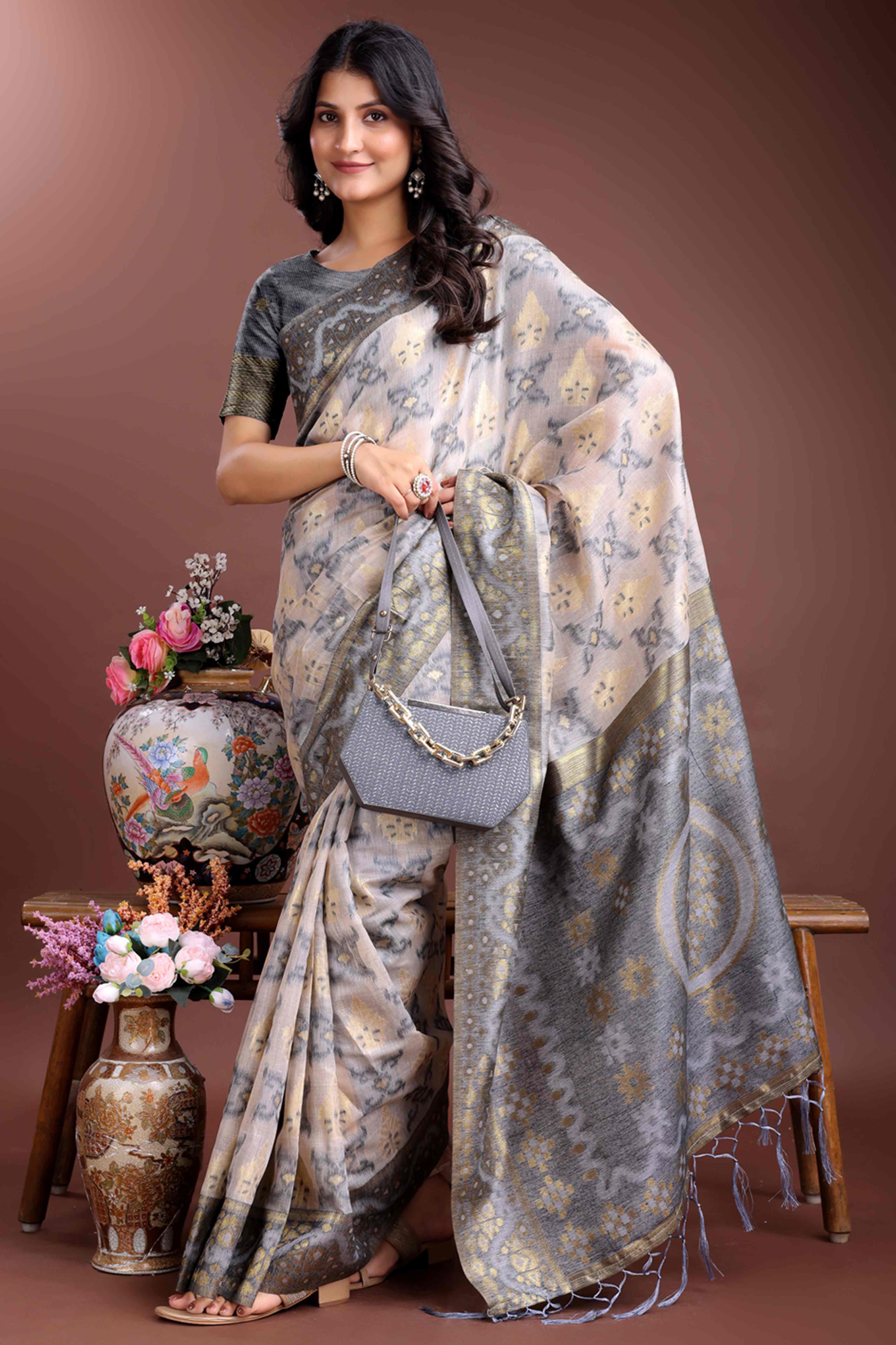 Stylish Grey Traditional Ikkat Style Zari Weaving Cotton Blend Saree with Subtle Tassel Ornaments