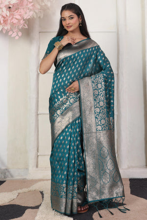 Rama Blue Traditional Lichi Silk Blend Saree Enhanced With Floral Zari Weaving & Tassel Pallu