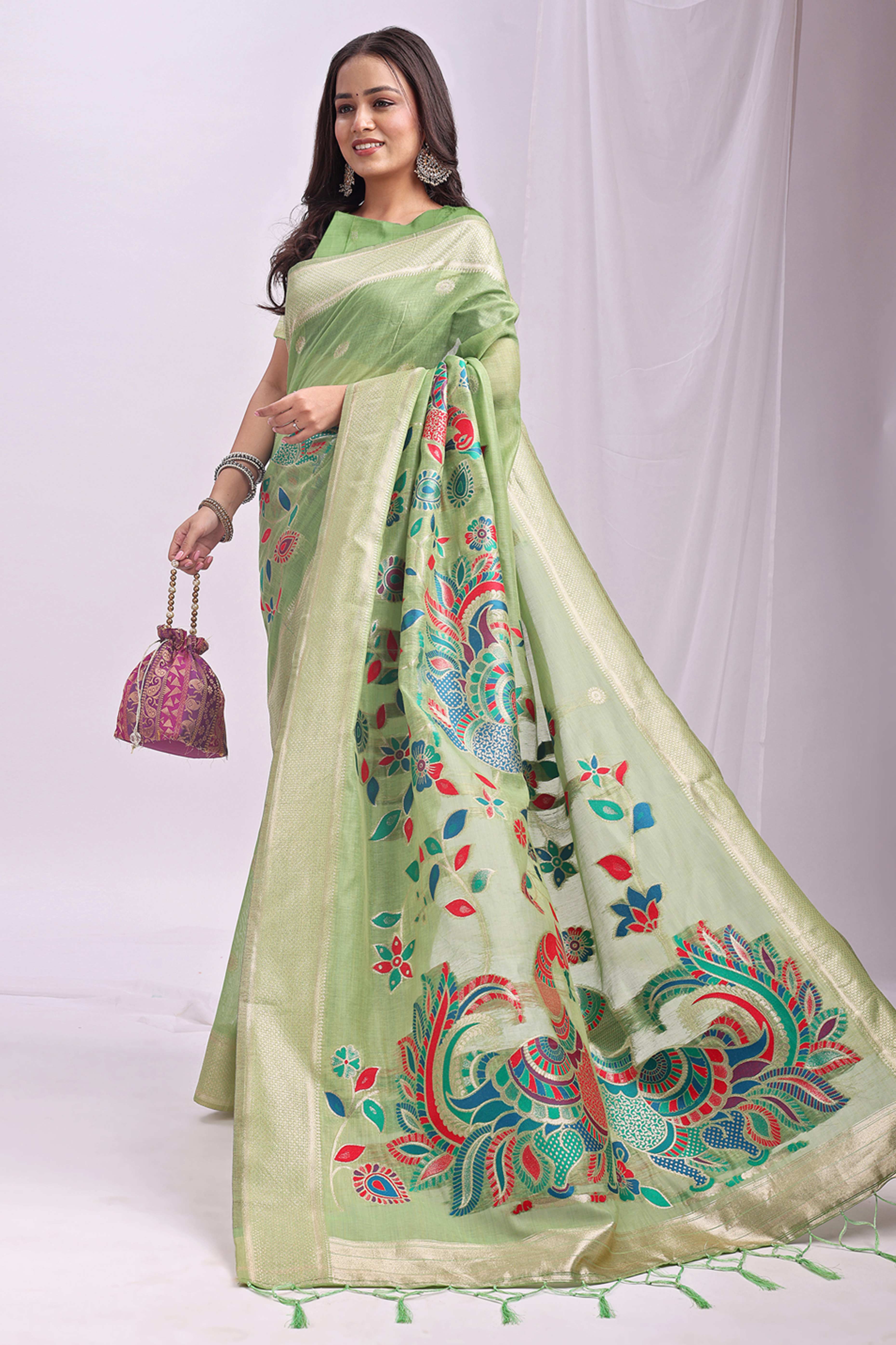 Light Green Floral Woven Linen Cotton Saree Accented With Peacock Motif Pallu & Zari Border
