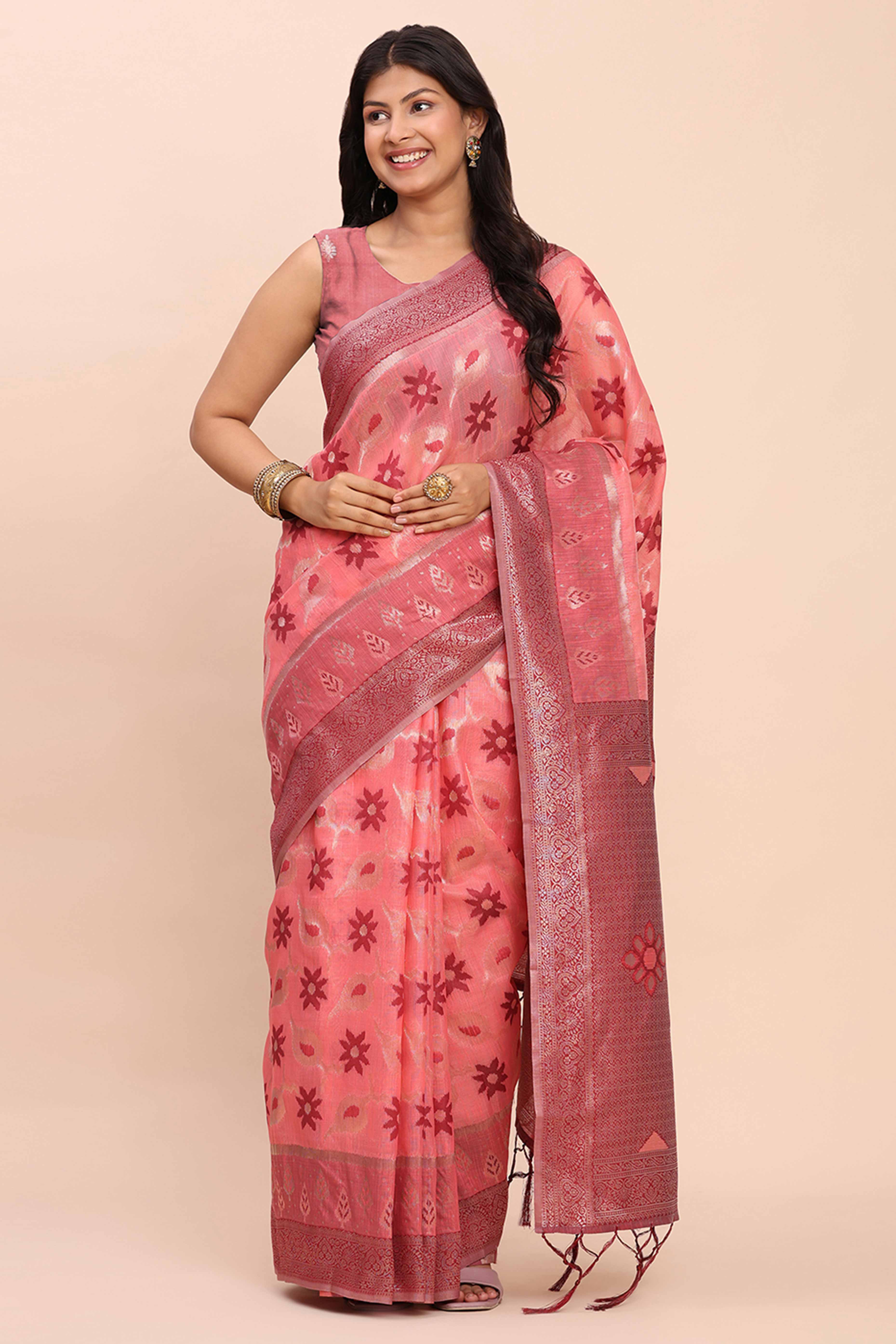 Salmon Pink Patola Inspired Linen Cotton Saree Adorned With Zari Weaving & Graceful Tassel Pallu