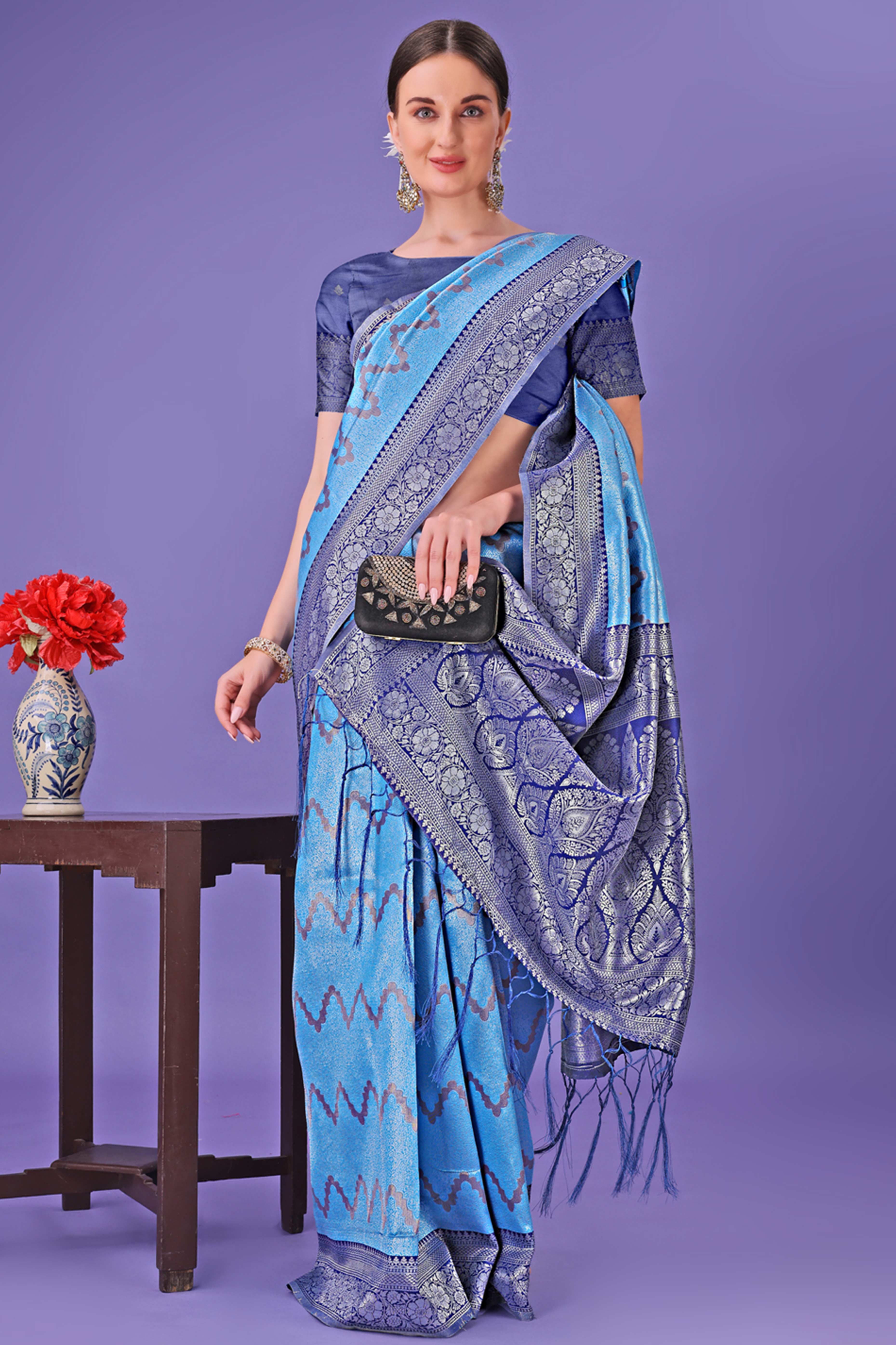 Blue Lichi Cotton Silk Saree Adorned With Floral Zari Weave & Tassels