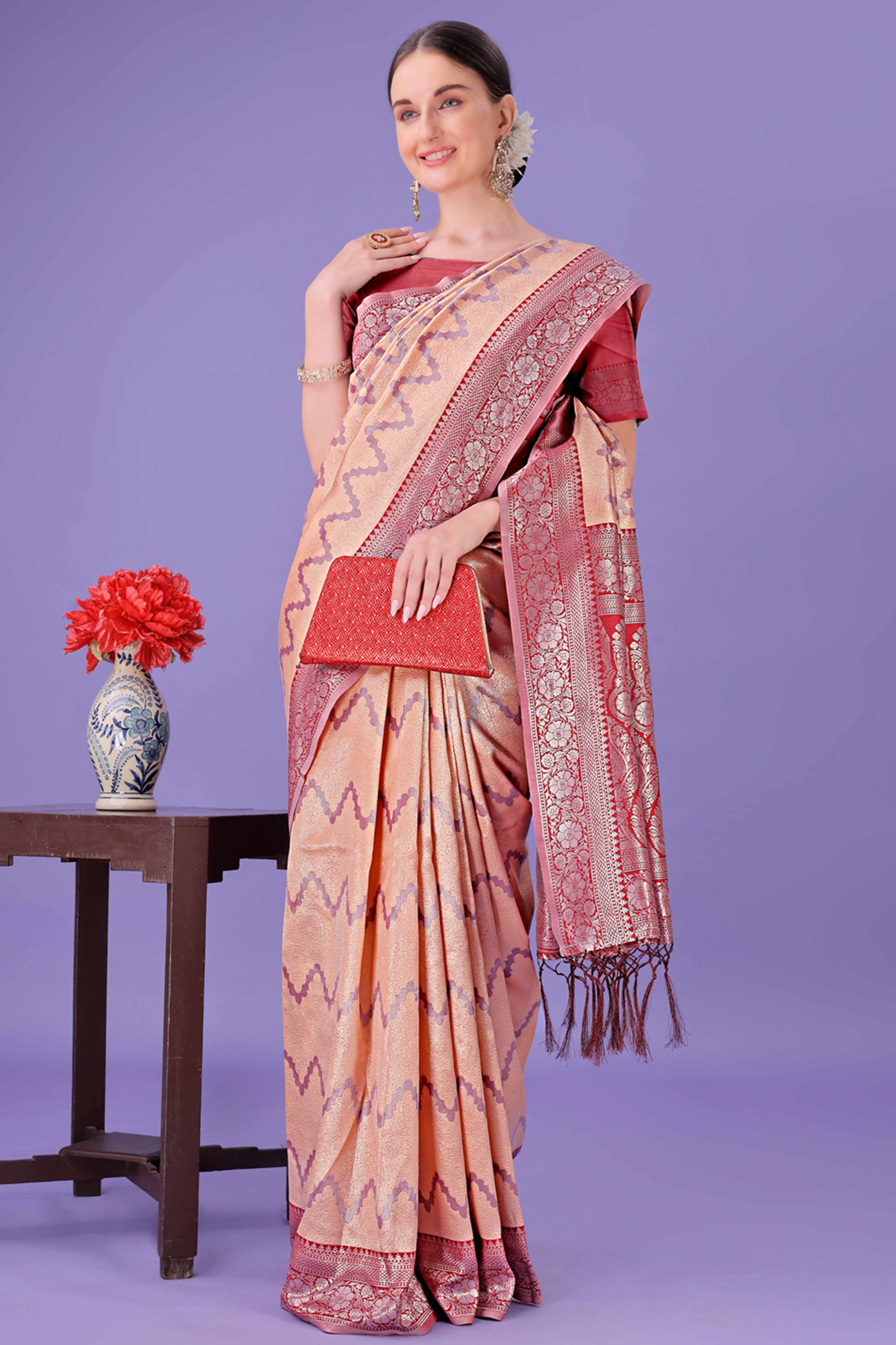 Peach Lichi Cotton Silk Saree Adorned With Floral Zari Weave & Tassels