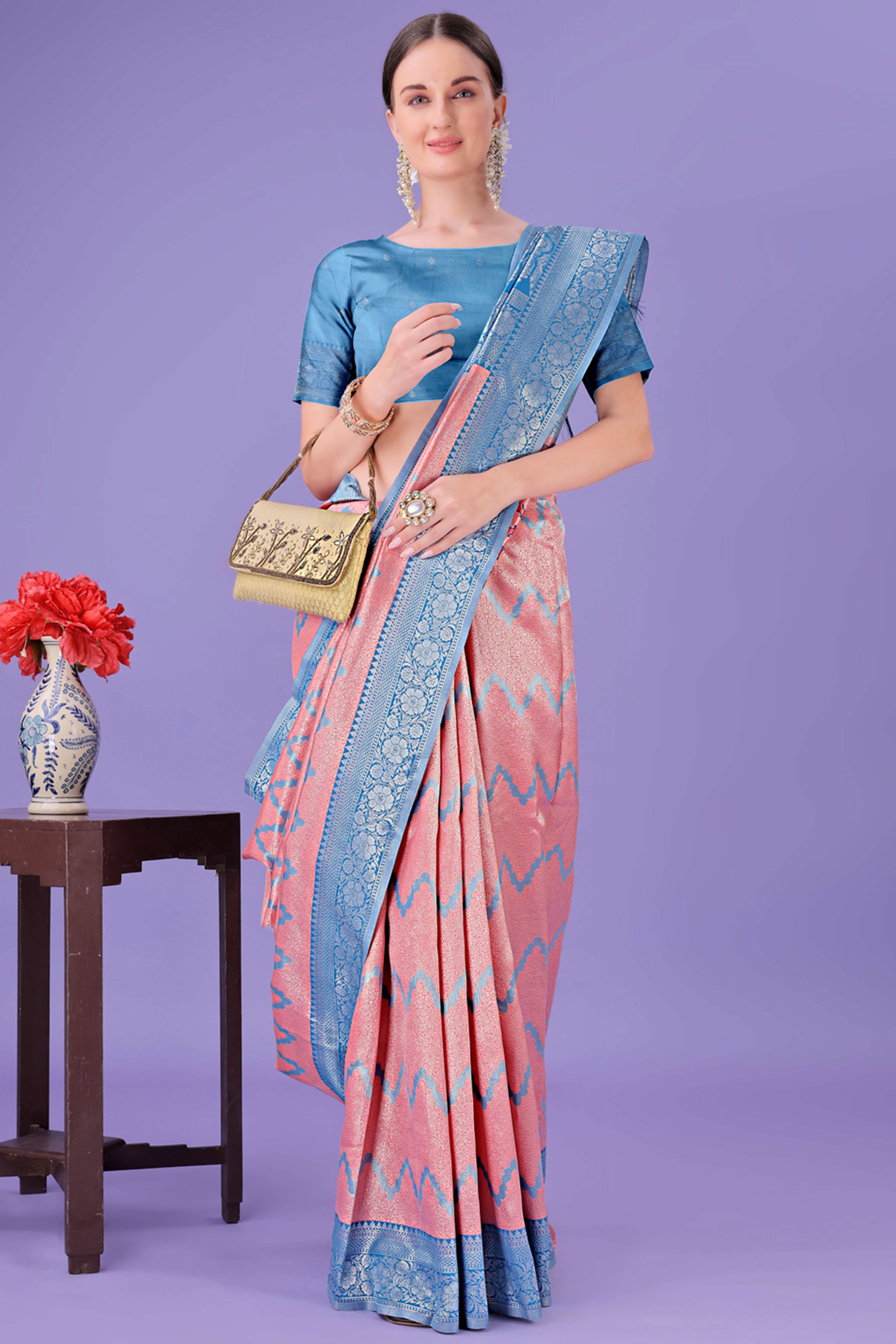 Peach Lichi Cotton Silk Saree Adorned With Floral Zari Weave & Tassels