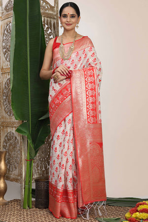 White & Red  Linen Cotton Saree Showcasing Elegant Zari Weaving And A Tassel-Embellished Pallu