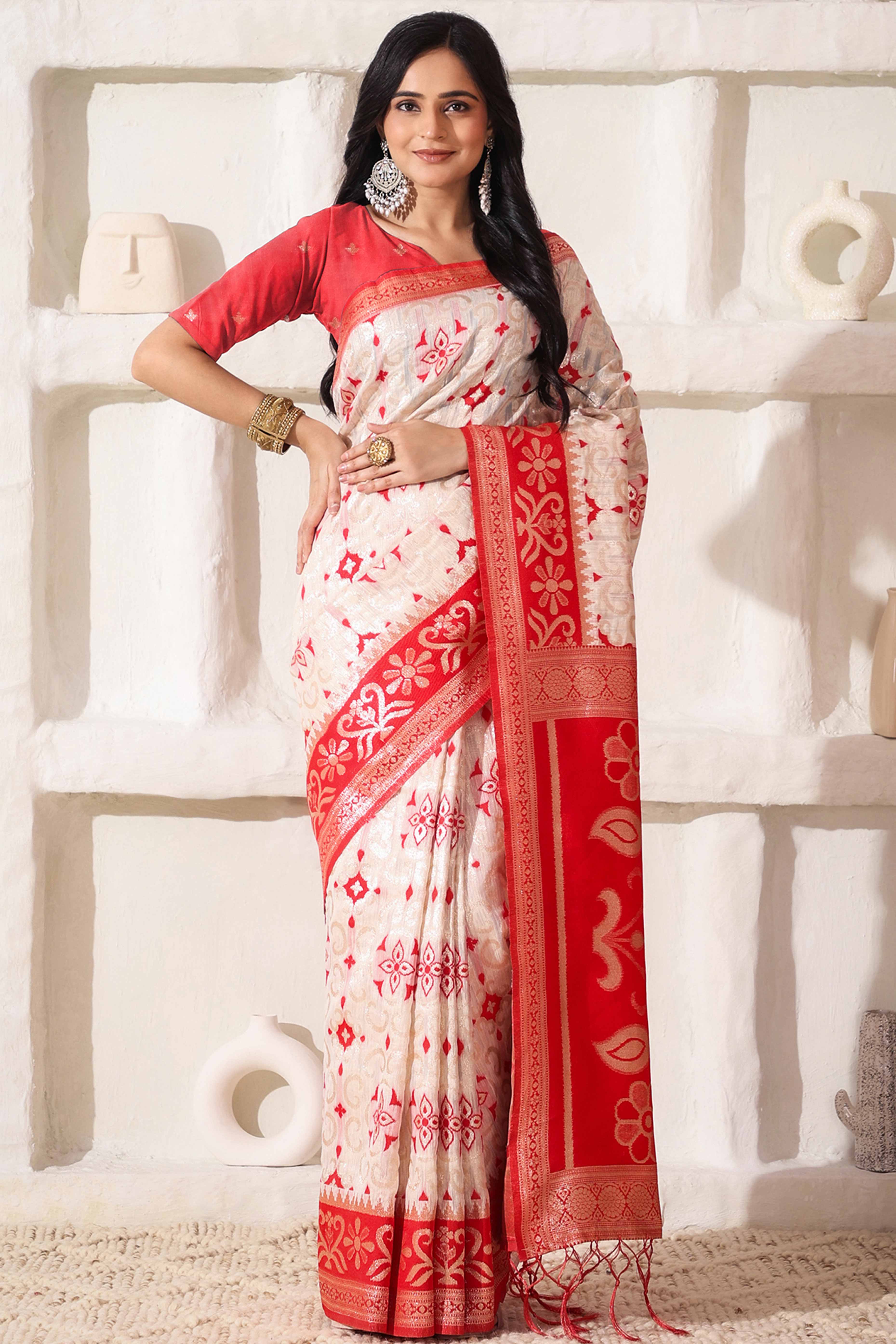 White & Red Linen Cotton Saree Adorned With Intricate Zari Weaving And Tassel Pallu