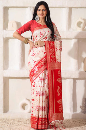 White & Red Linen Cotton Saree Adorned With Intricate Zari Weaving And Tassel Pallu