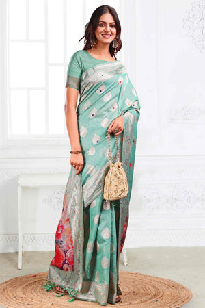 Turquoise Linen Cotton Silk Saree Adorned With Intricate Floral Zari Weaving & Tassel Pallu