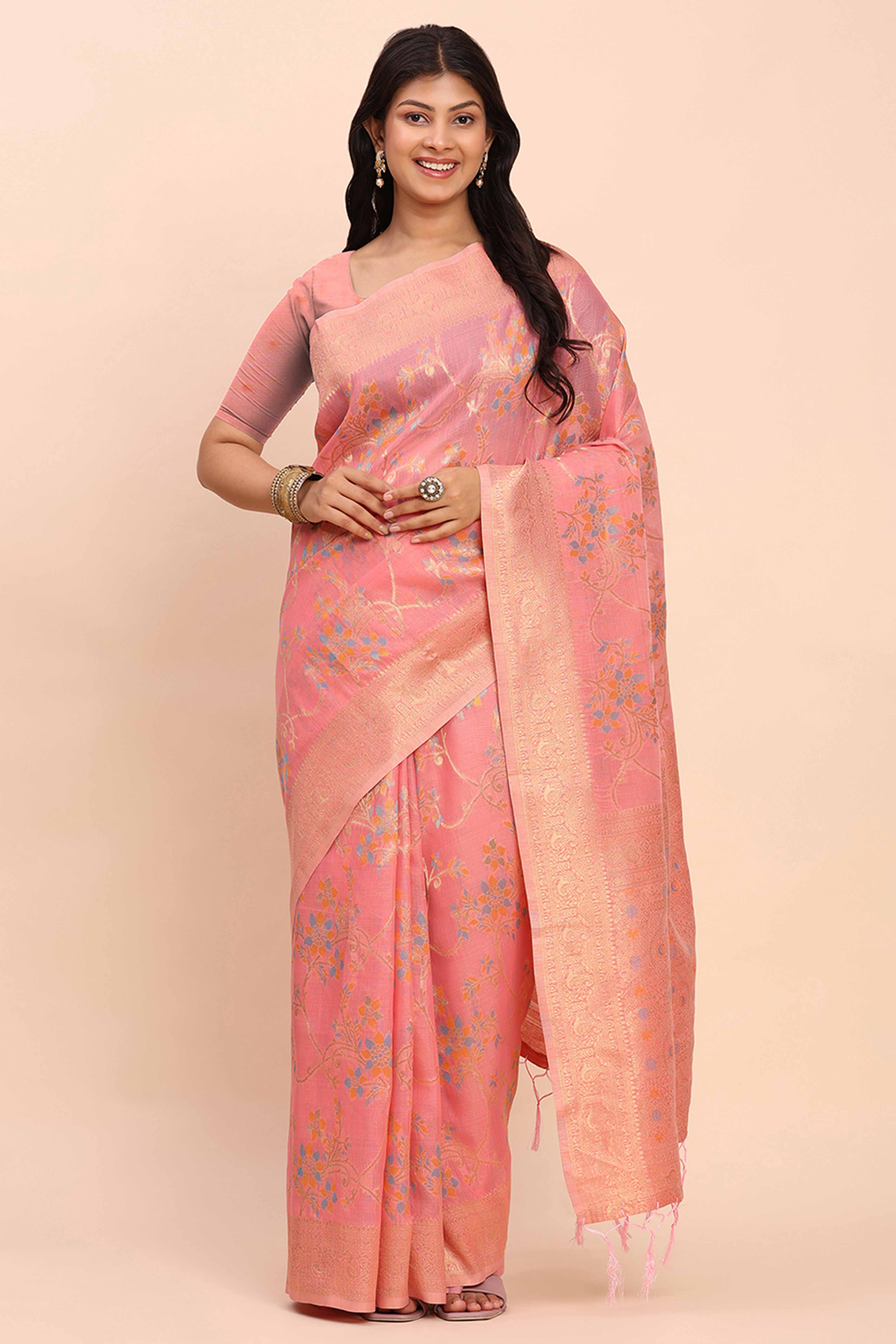 Salmon Pink Linen Cotton Saree Showcasing Floral Zari Weaves & A Tasselled Finish Pallu