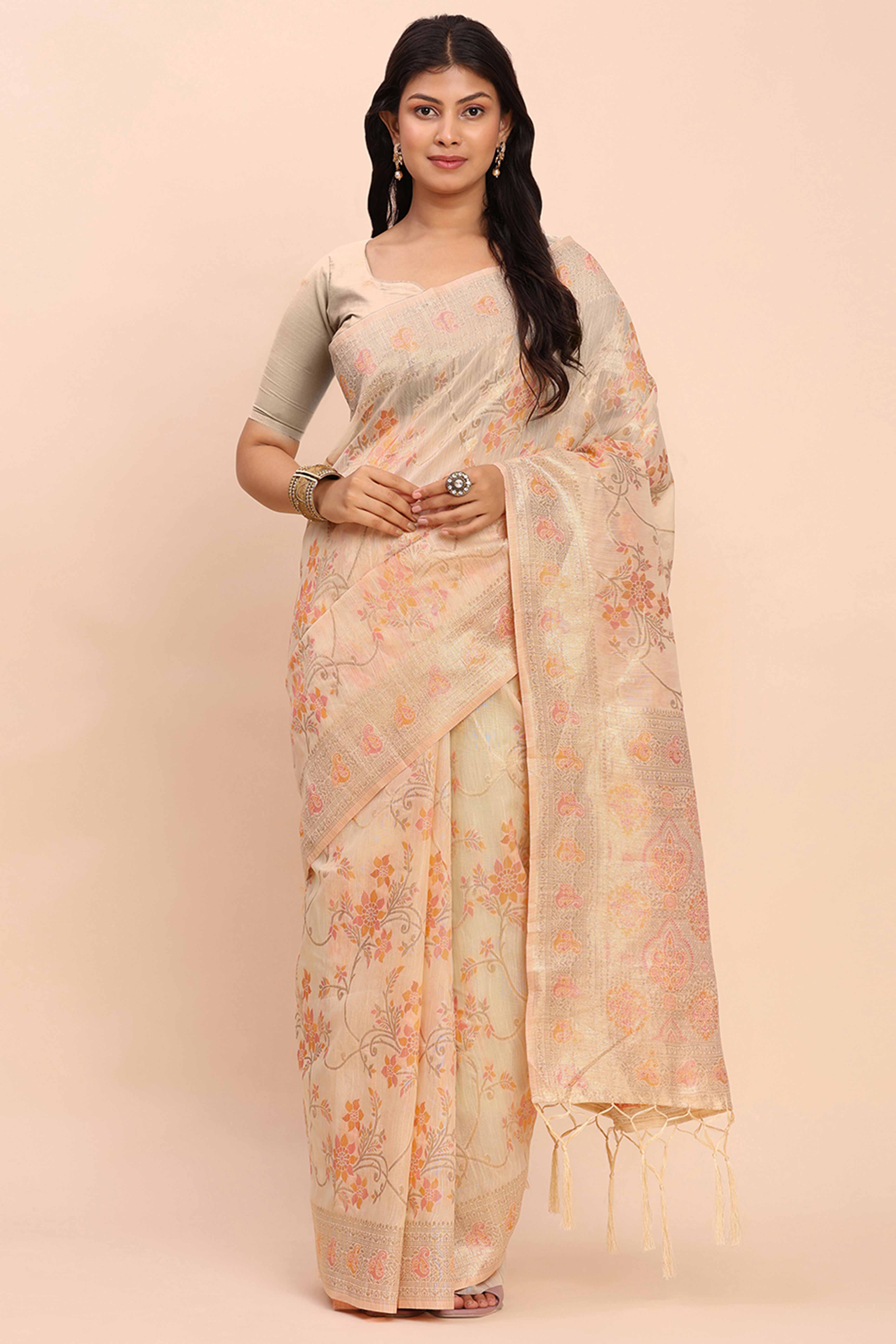 Cream Linen Cotton Saree Showcasing Floral Zari Weaves & A Tasselled Finish Pallu