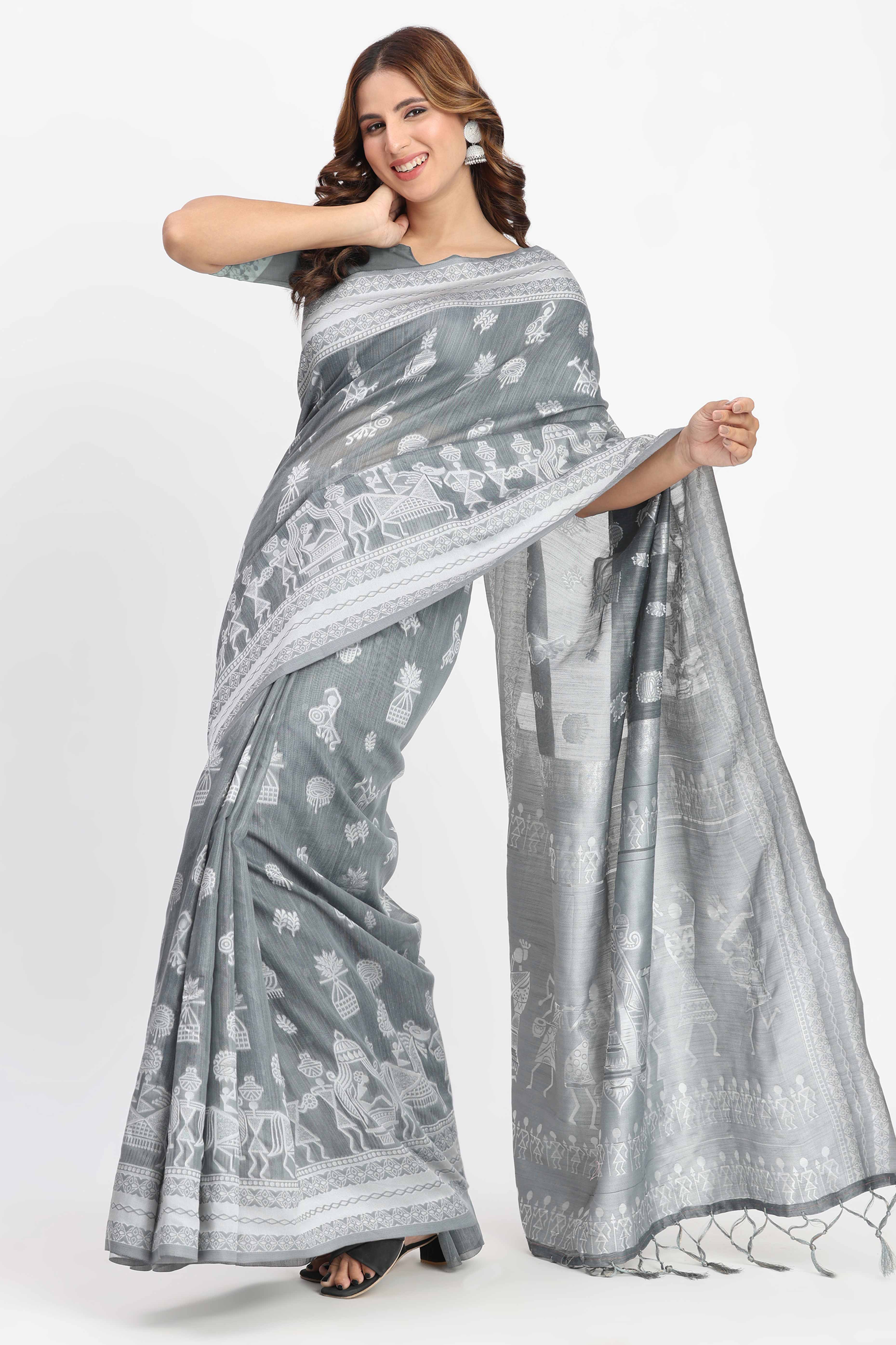 Grey Linen Cotton Saree Showcasing Traditional Warli Motifs In Zari Weaving With Tassel Pallu