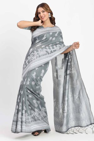 Grey Linen Cotton Saree Showcasing Traditional Warli Motifs In Zari Weaving With Tassel Pallu
