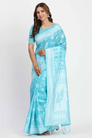 Blue Linen Cotton Saree Showcasing Traditional Warli Motifs In Zari Weaving With Tassel Pallu