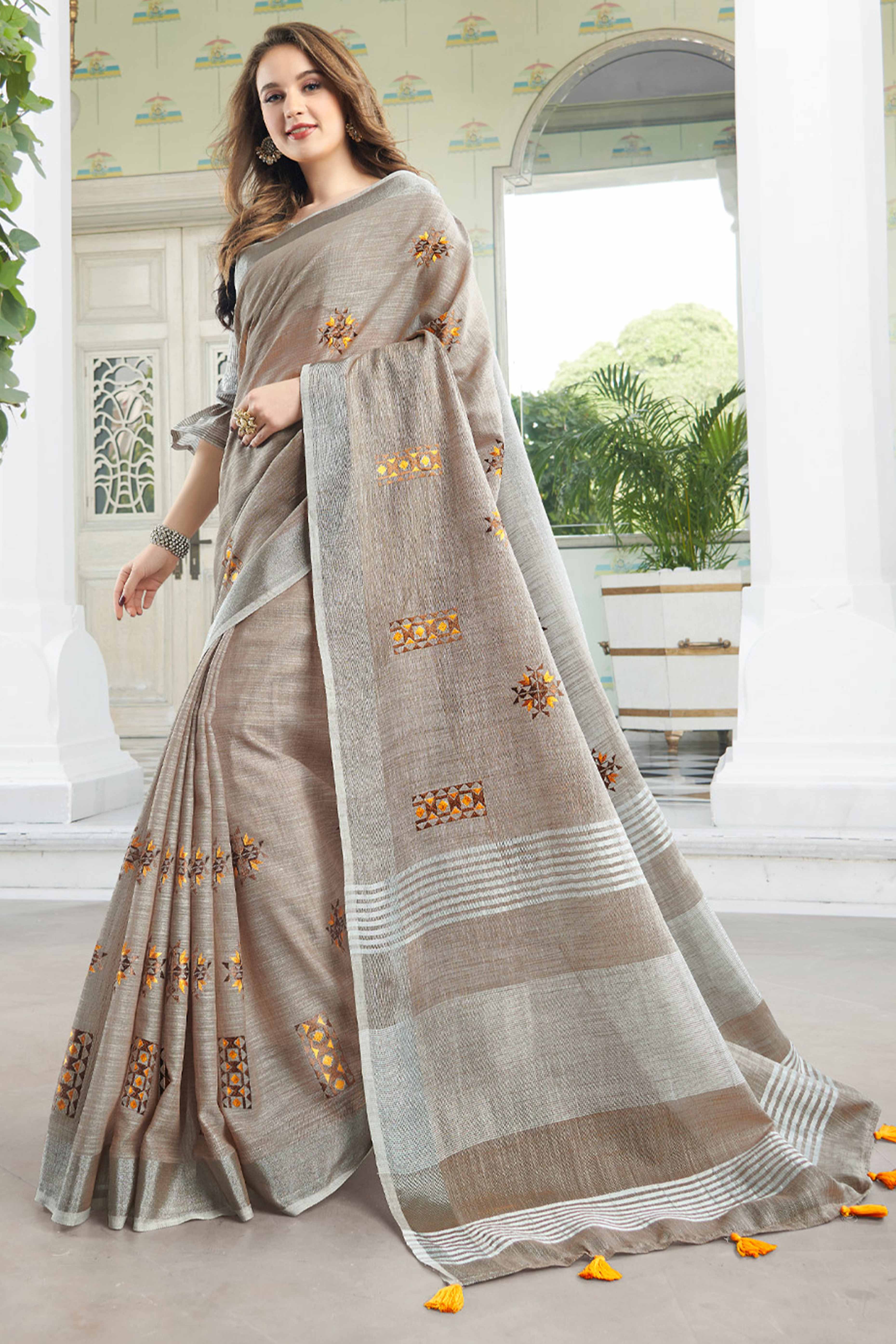 Light Beige Linen Saree with Intricate Floral Embroidery and Classic Weaving