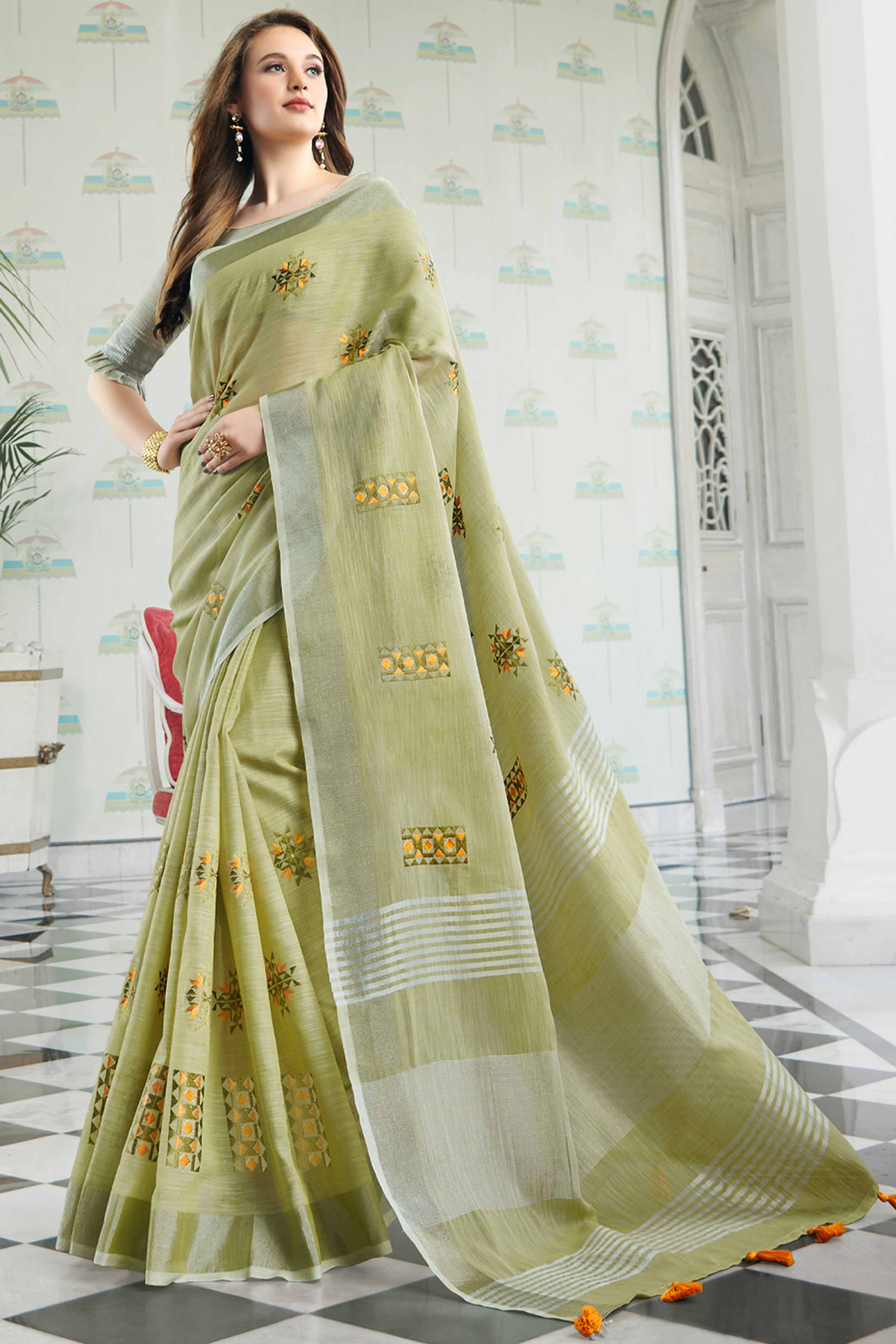 Pista Green Linen Saree with Intricate Floral Embroidery and Classic Weaving