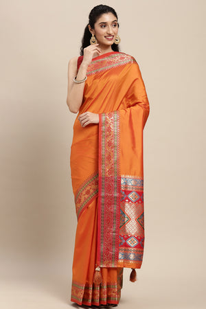 Graceful Orange Solid Saree Highlighted With Floral Zari Weaving On Silk Blend & Tassel Pallu