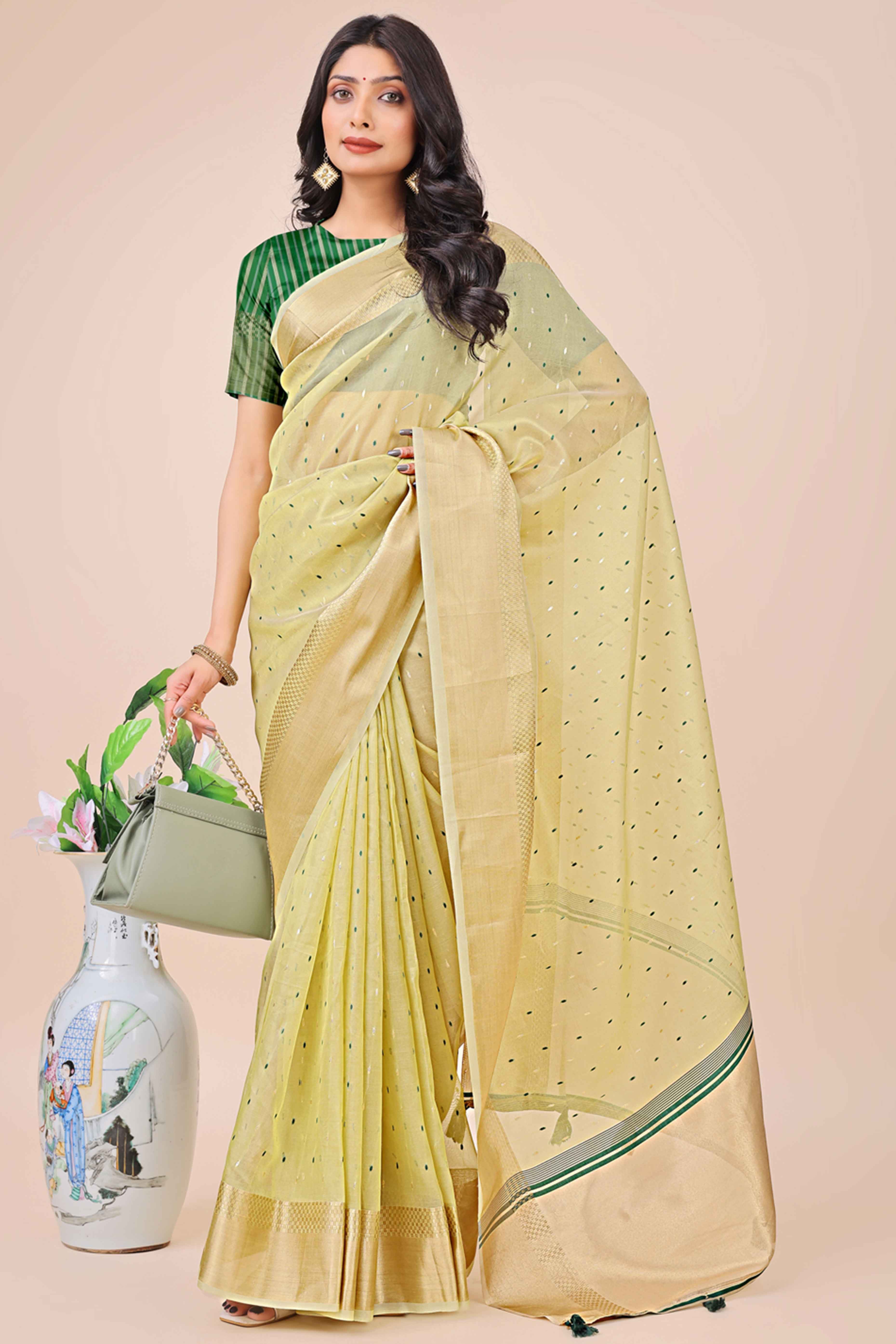 Light Green Organza Saree Adorned With Fine Zari Weaving & Stylish Tassel Edging